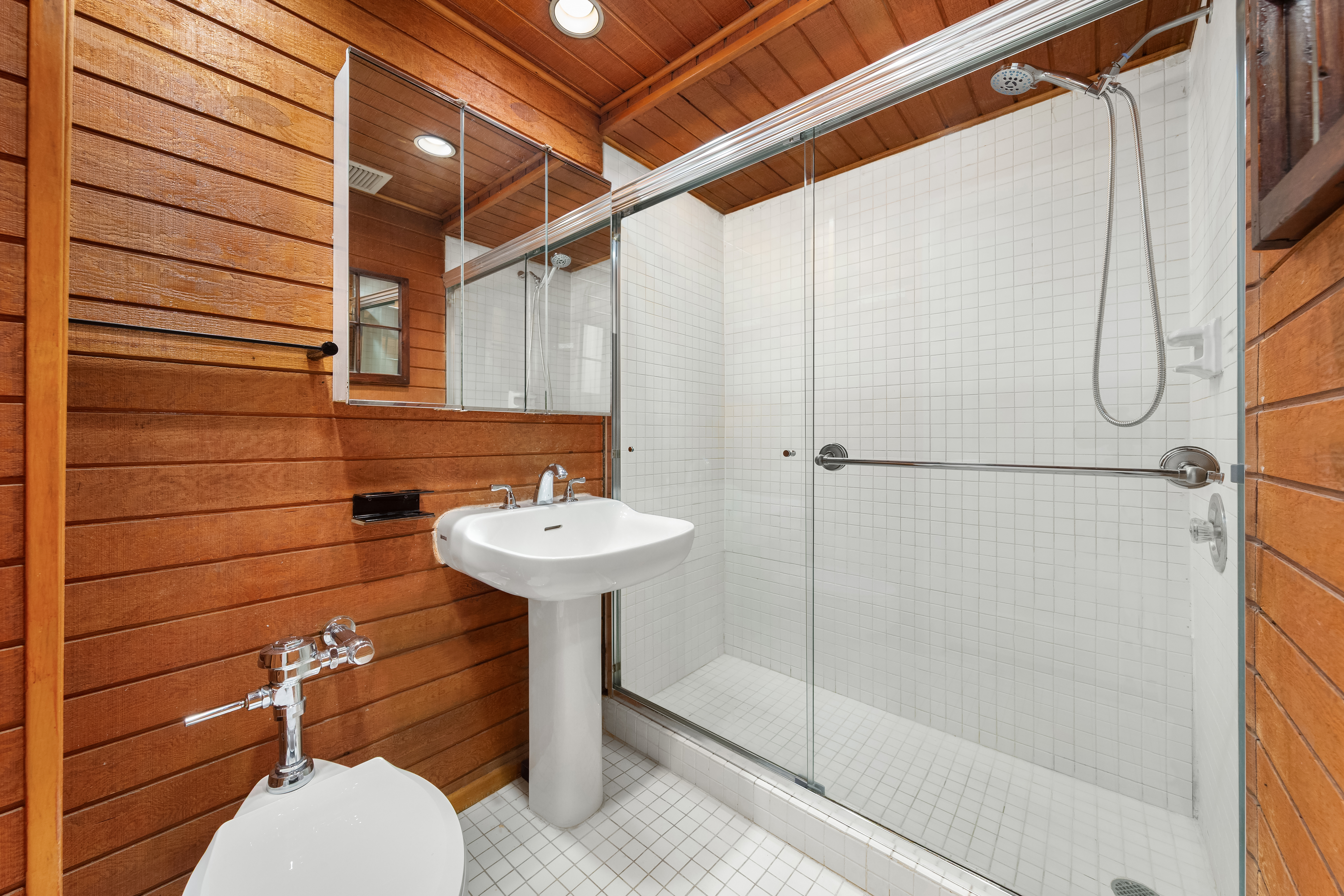 1 5th Avenue, Unit 2B Manhattan, NY 10003 - Photo 6 of 12 a bathroom with a sink and shower