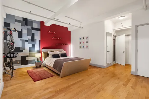 a bedroom with a bed and a table in it