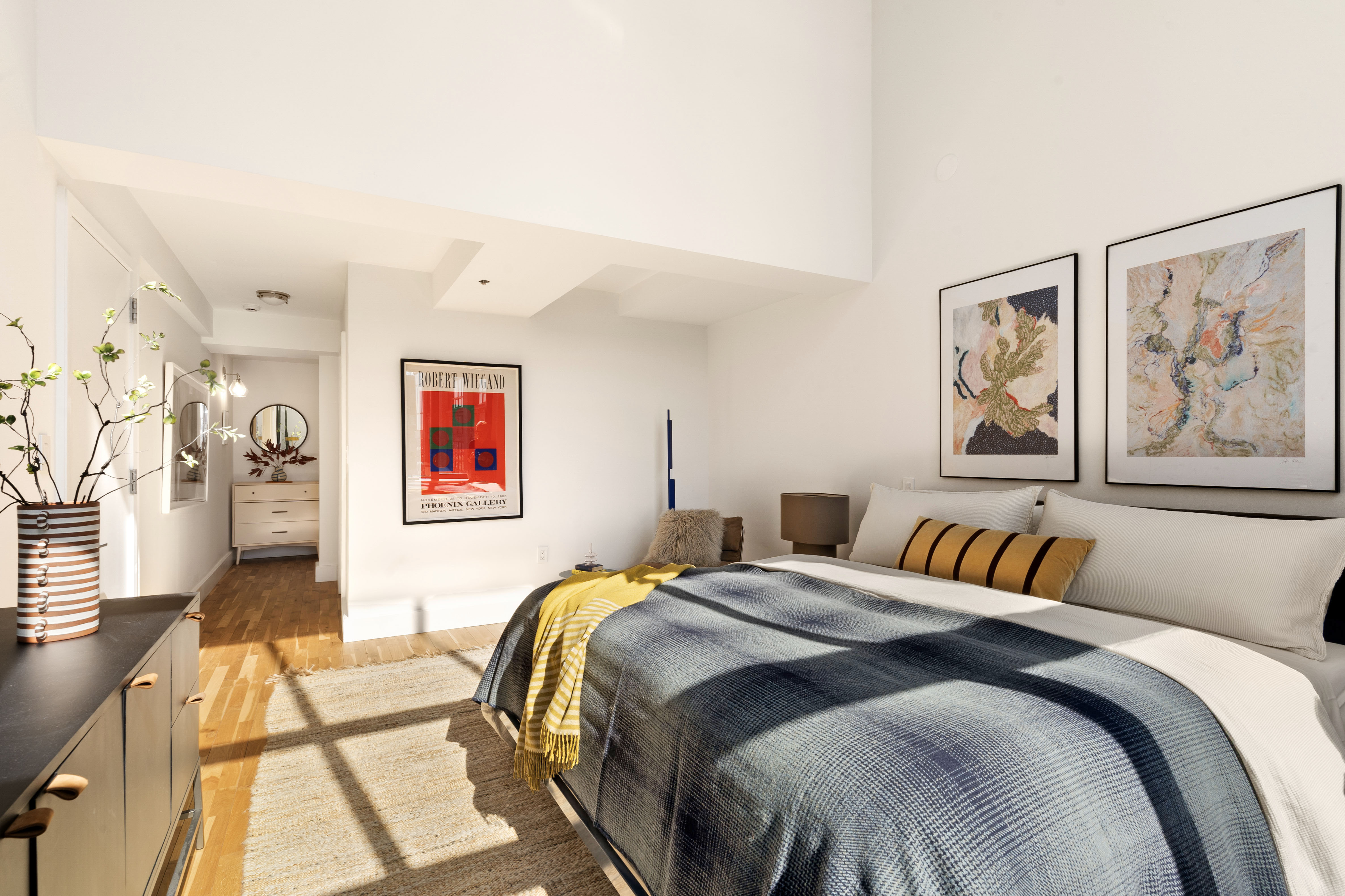 360 Furman Street, Unit 1041/1042 Brooklyn, NY 11201 - Photo 10 of 30 a bedroom with a bed and a painting on the wall