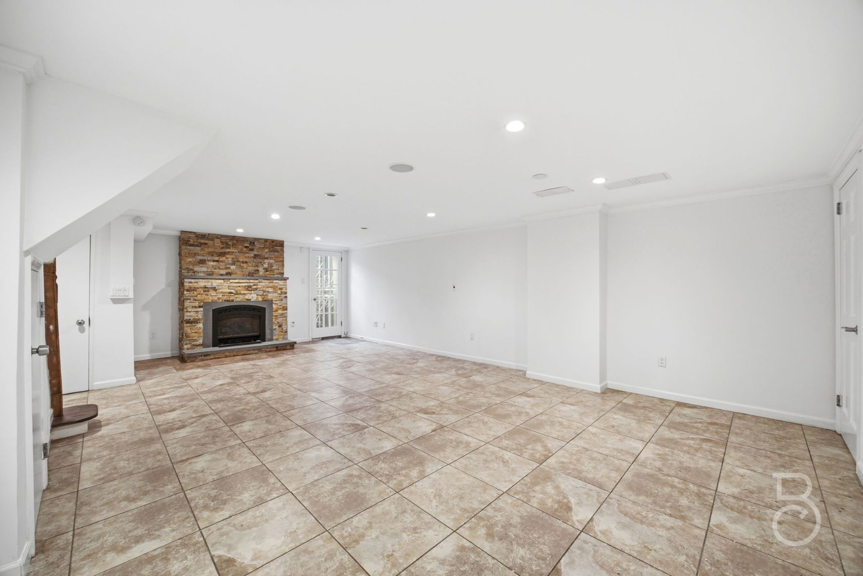 22-61 46th Street Queens, NY 11105 - Photo 24 of 24 a view of an empty room with a fireplace