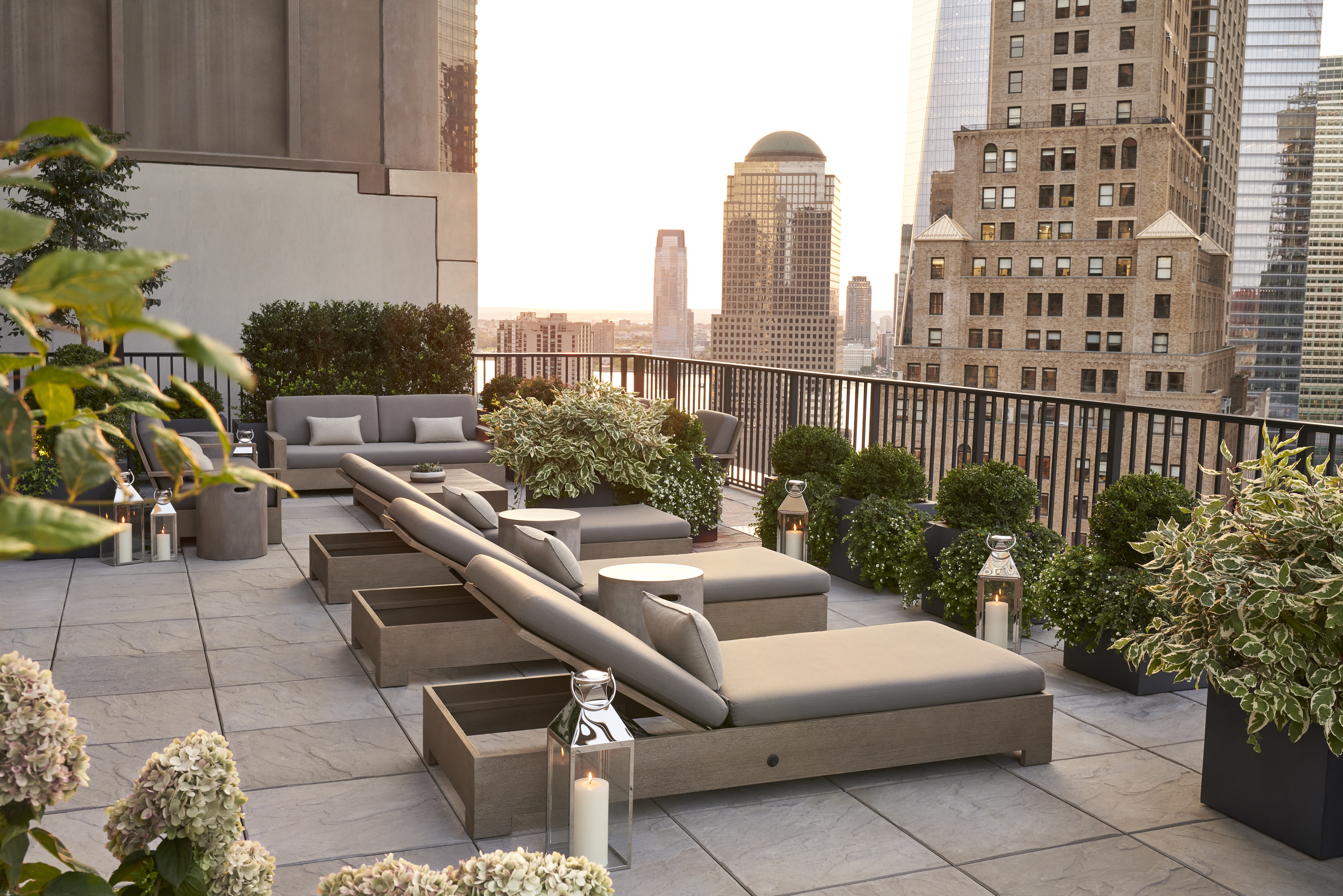 33 Park Row, Unit 6B Manhattan, NY 10038 - Photo 15 of 20 a roof deck with couch and potted plants
