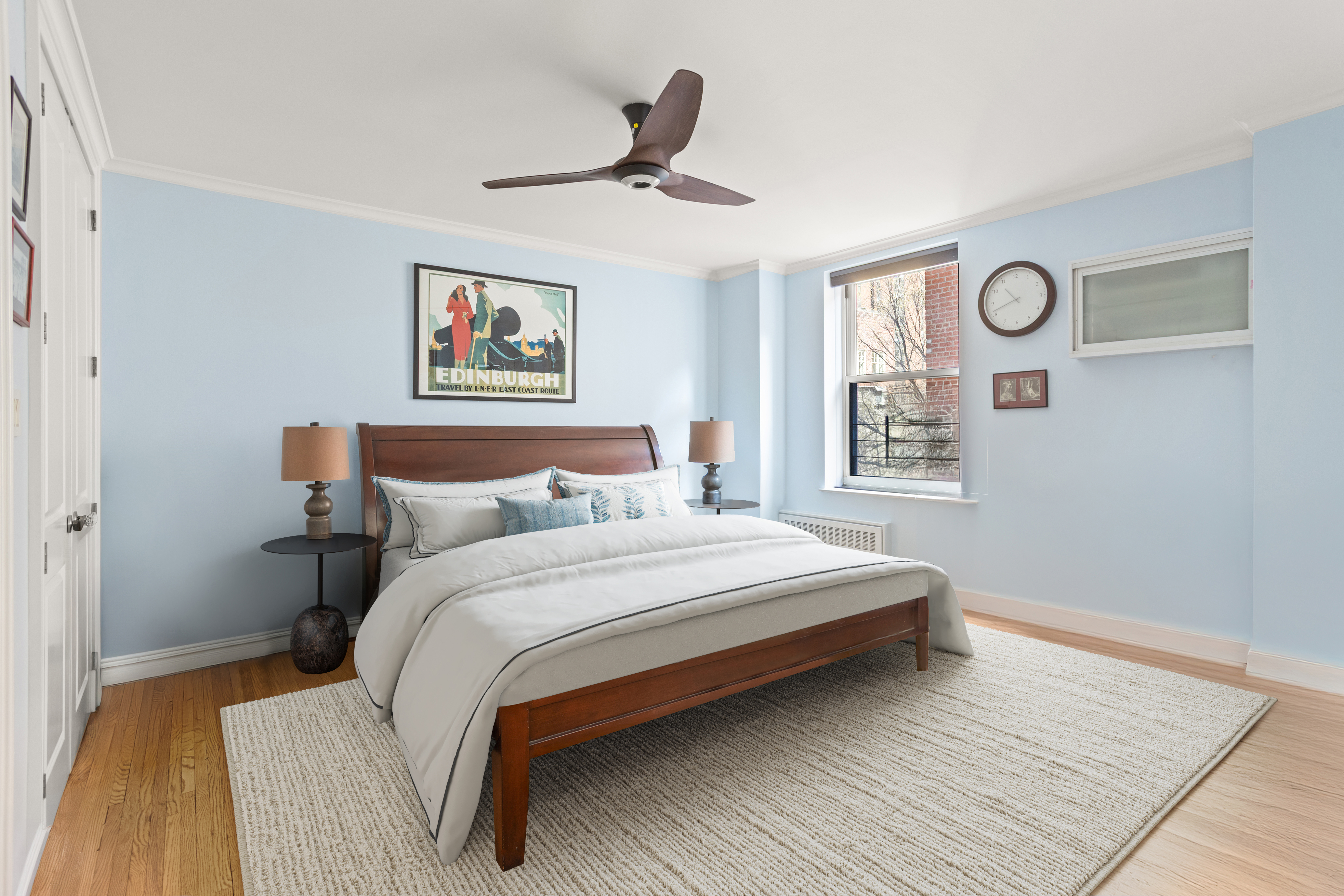 161 East 90th Street, Unit 5C Manhattan, NY 10128 - Photo 7 of 14 a bedroom with a bed and a painting on the wall