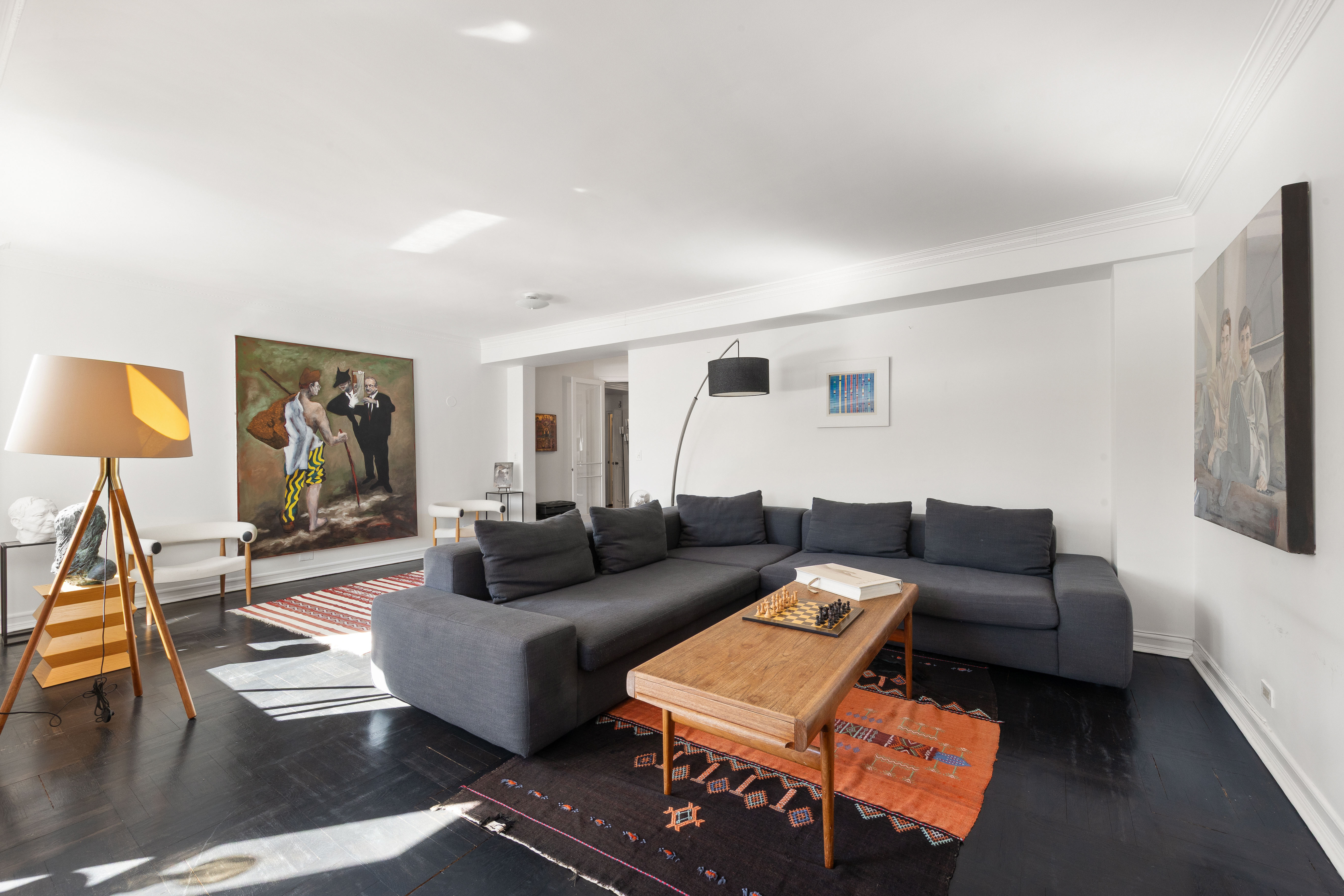 875 5th Avenue, Unit 9GH Manhattan, NY 10065 - Photo 3 of 13 a living room with furniture and a flat screen tv