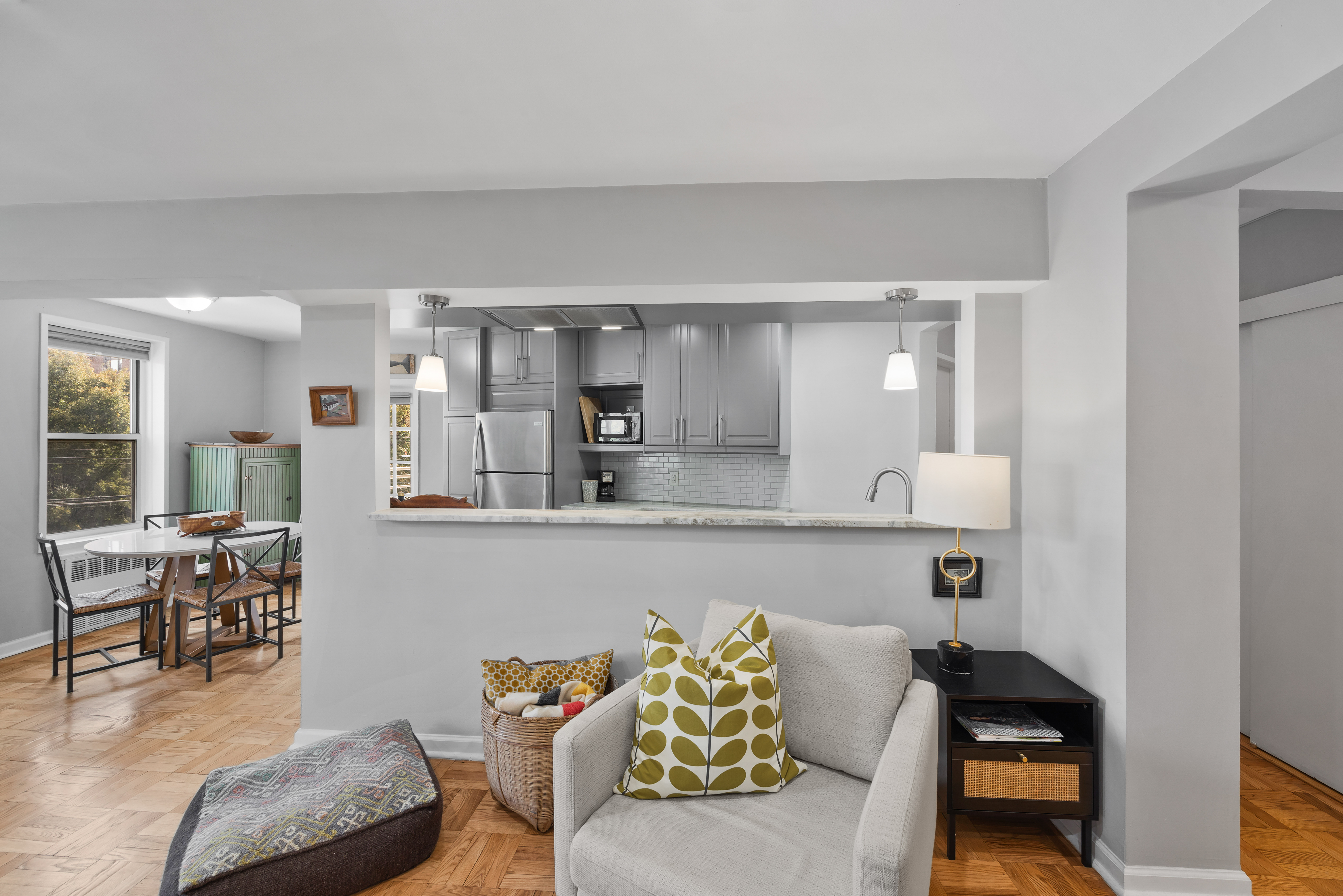 255 Fieldston Terrace, Unit 2L Bronx, NY 10471 - Photo 5 of 32 a living room with furniture and a table