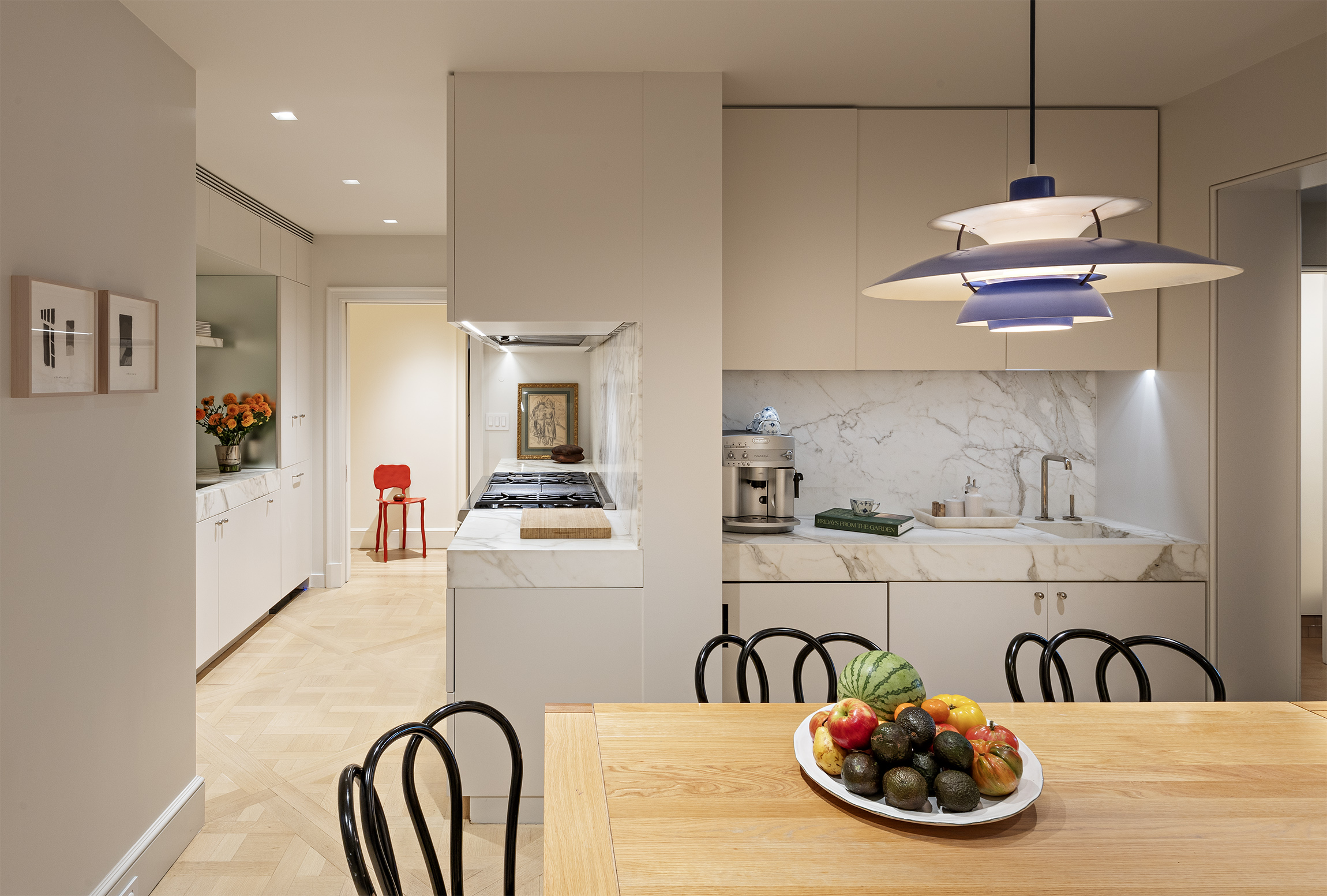 133 East 64th Street, Unit 2B Manhattan, NY 10065 - Photo 6 of 14 a kitchen with a sink and wooden floor