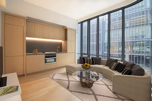 a living room with furniture a large window and a flat screen tv
