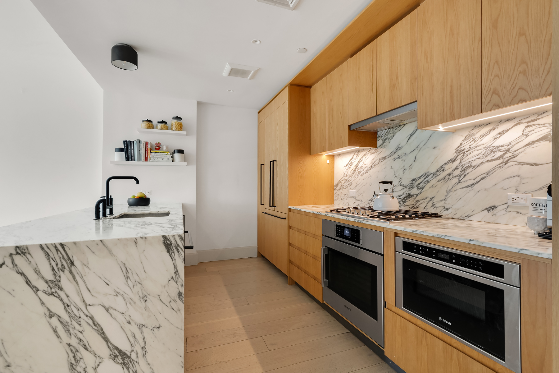 308 North 7th Street, Unit 2F Brooklyn, NY 11211 - Photo 4 of 17 a kitchen with a stove and a sink