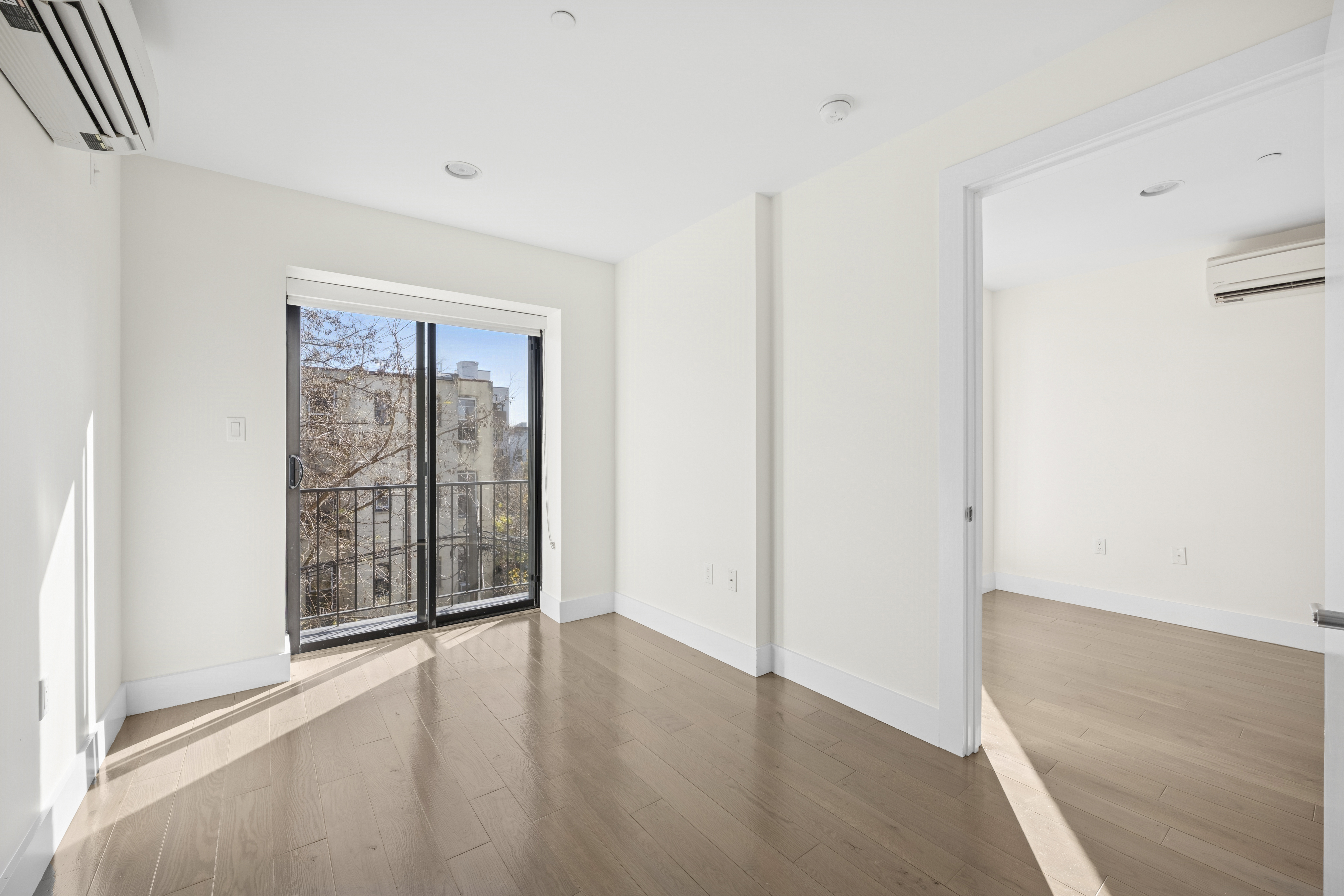 1164 Greene Avenue, Unit 3A Brooklyn, NY 11221 - Photo 3 of 11 an empty room with windows and closet