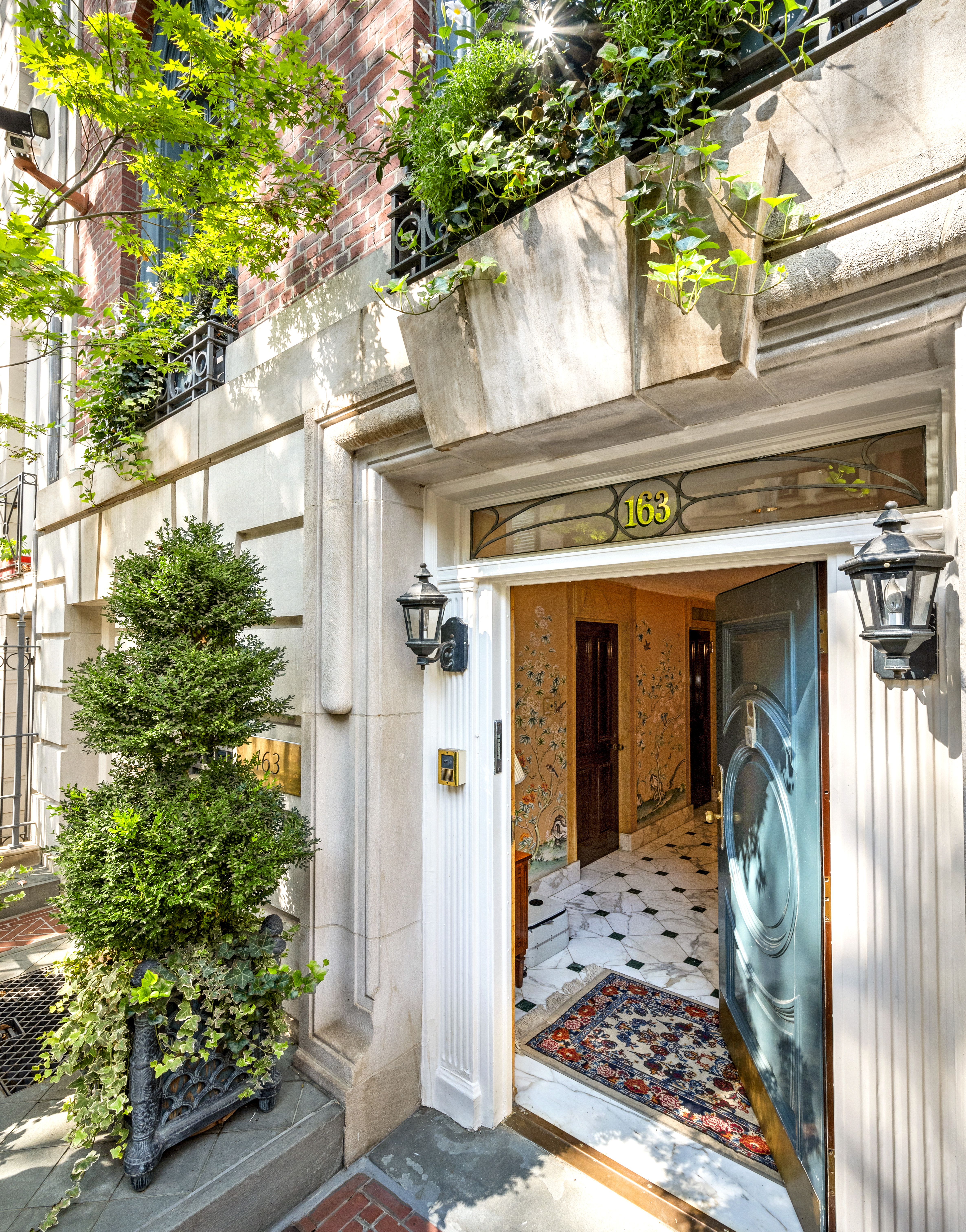 163 East 64th Street Manhattan, NY 10065 - Photo 5 of 34 a view of a front door of the house and tree