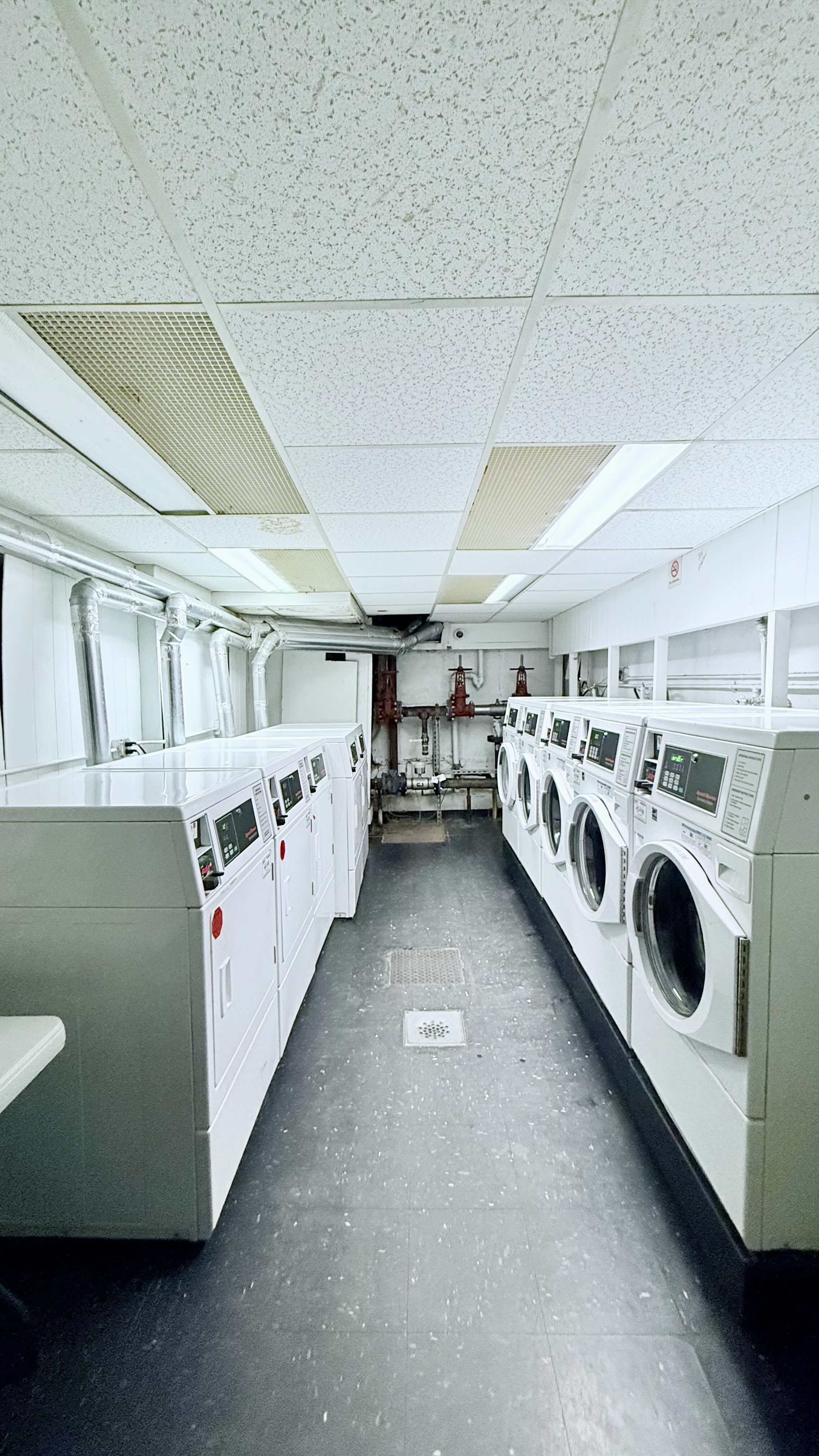 229 East 29th Street, Unit 5H Manhattan, NY 10016 - Photo 8 of 15 a utility room with dryer and washer