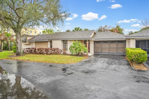 a view of house with yard and entertaining space