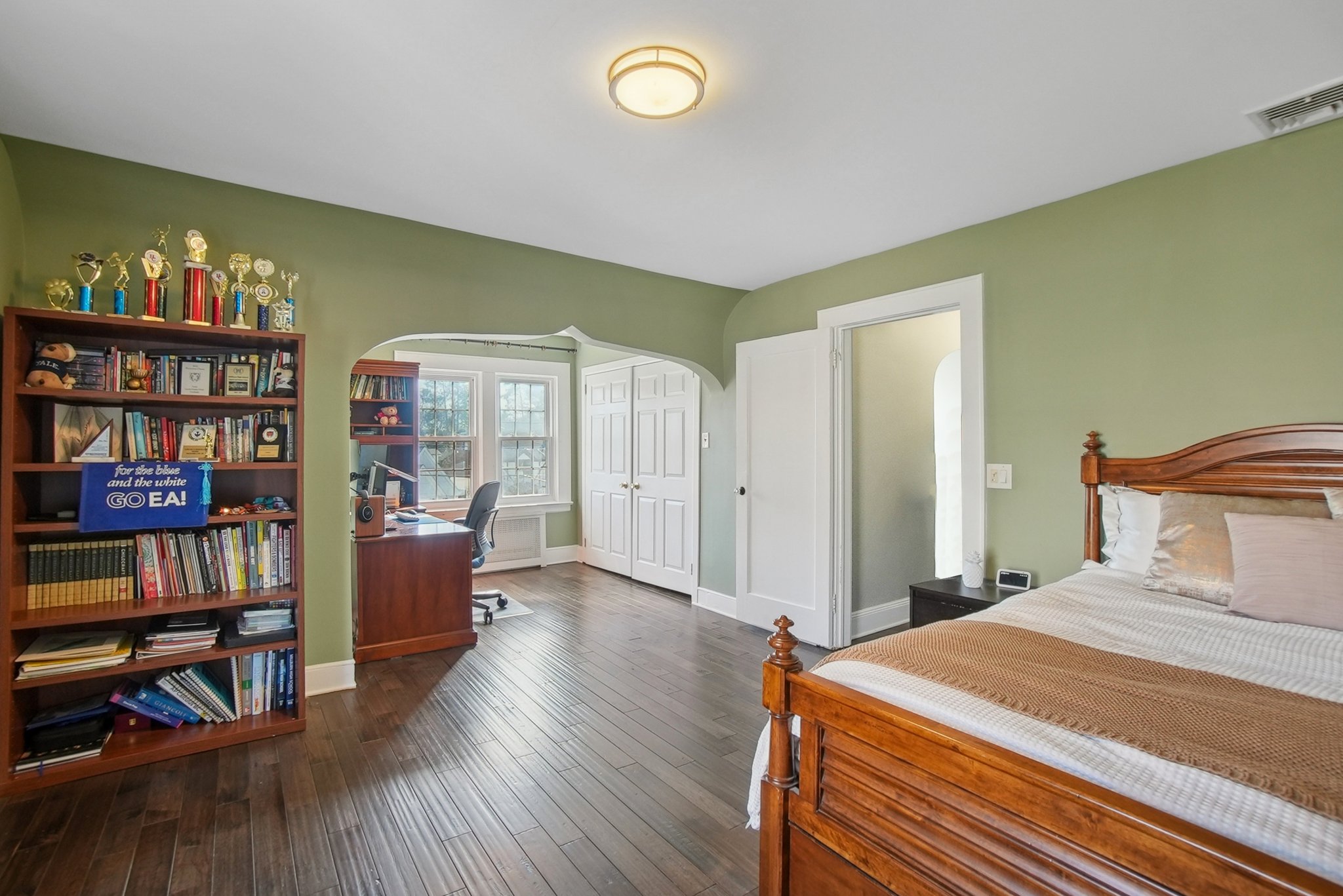 877 Ridgewood Road Millburn, NJ 07041 - Photo 25 of 37 a bedroom with a bed and a bookshelf