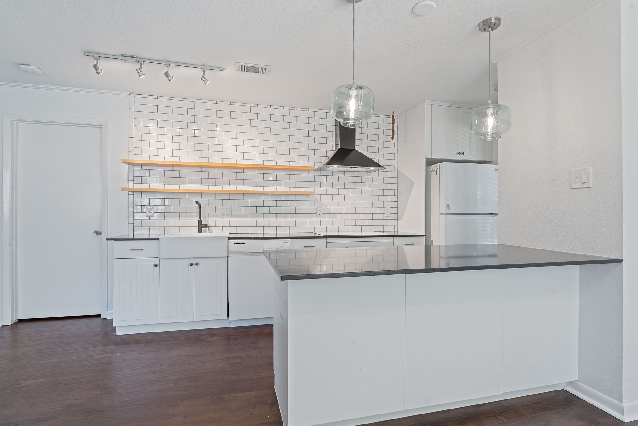1510 West N Loop Boulevard, Unit 424 Austin, TX 78756 - Photo 2 of 25 a kitchen with a sink a refrigerator and window