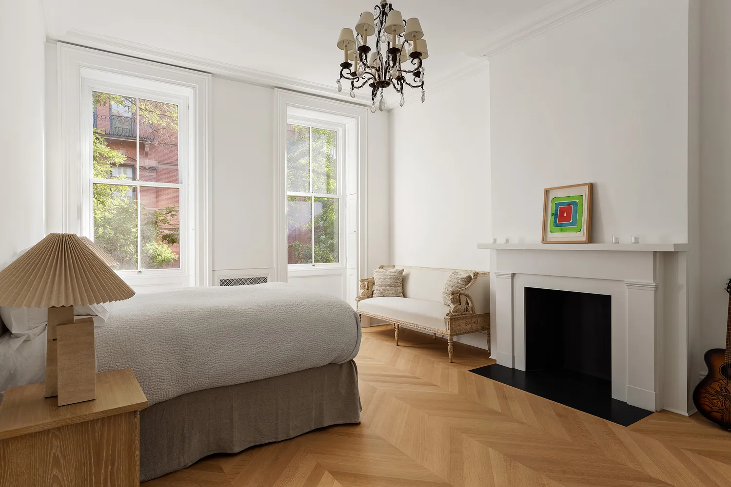 a bedroom with a bed and a fireplace