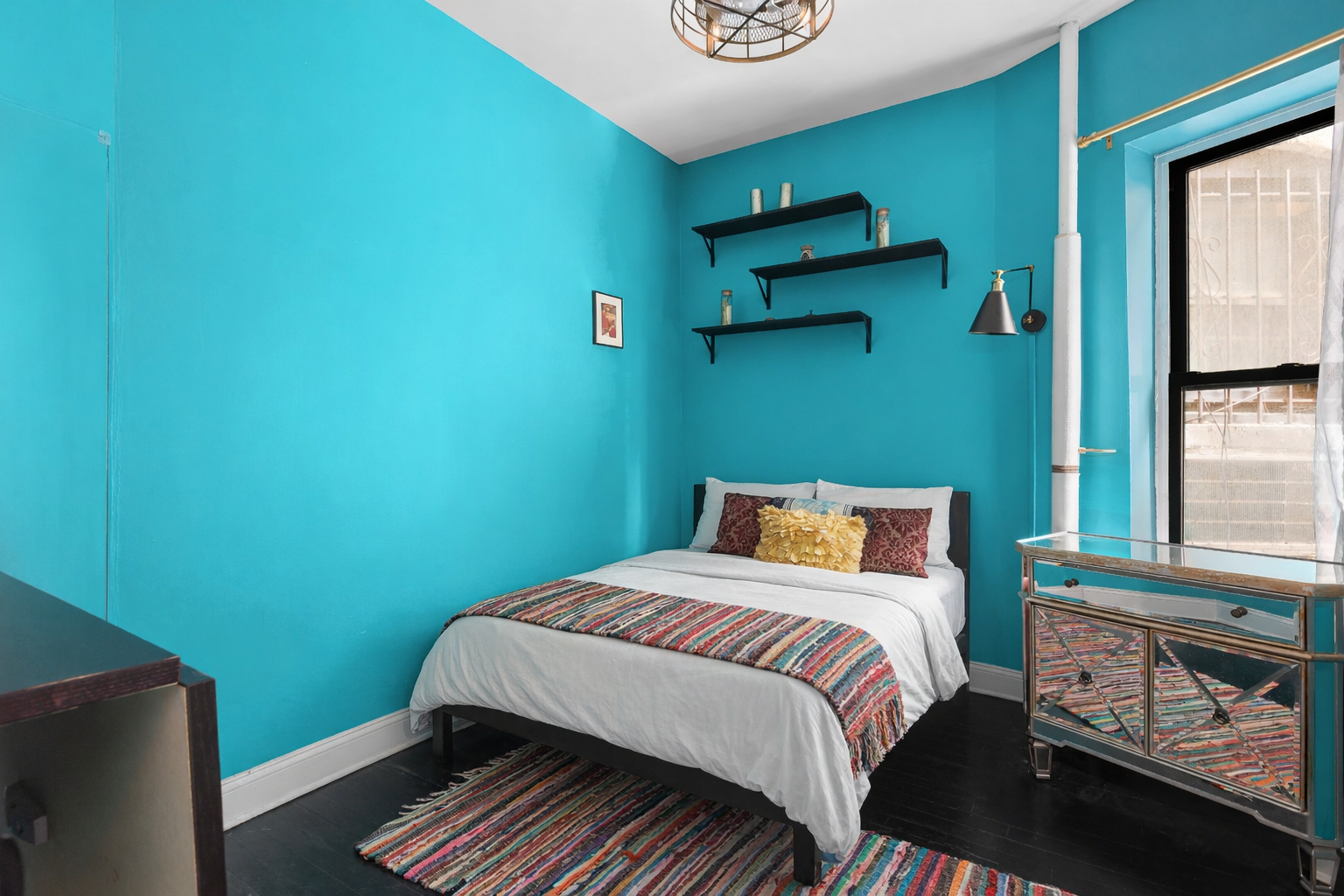 786 9th Avenue, Unit 2FN Manhattan, NY 10019 - Photo 3 of 6 a bedroom with a bed and a window