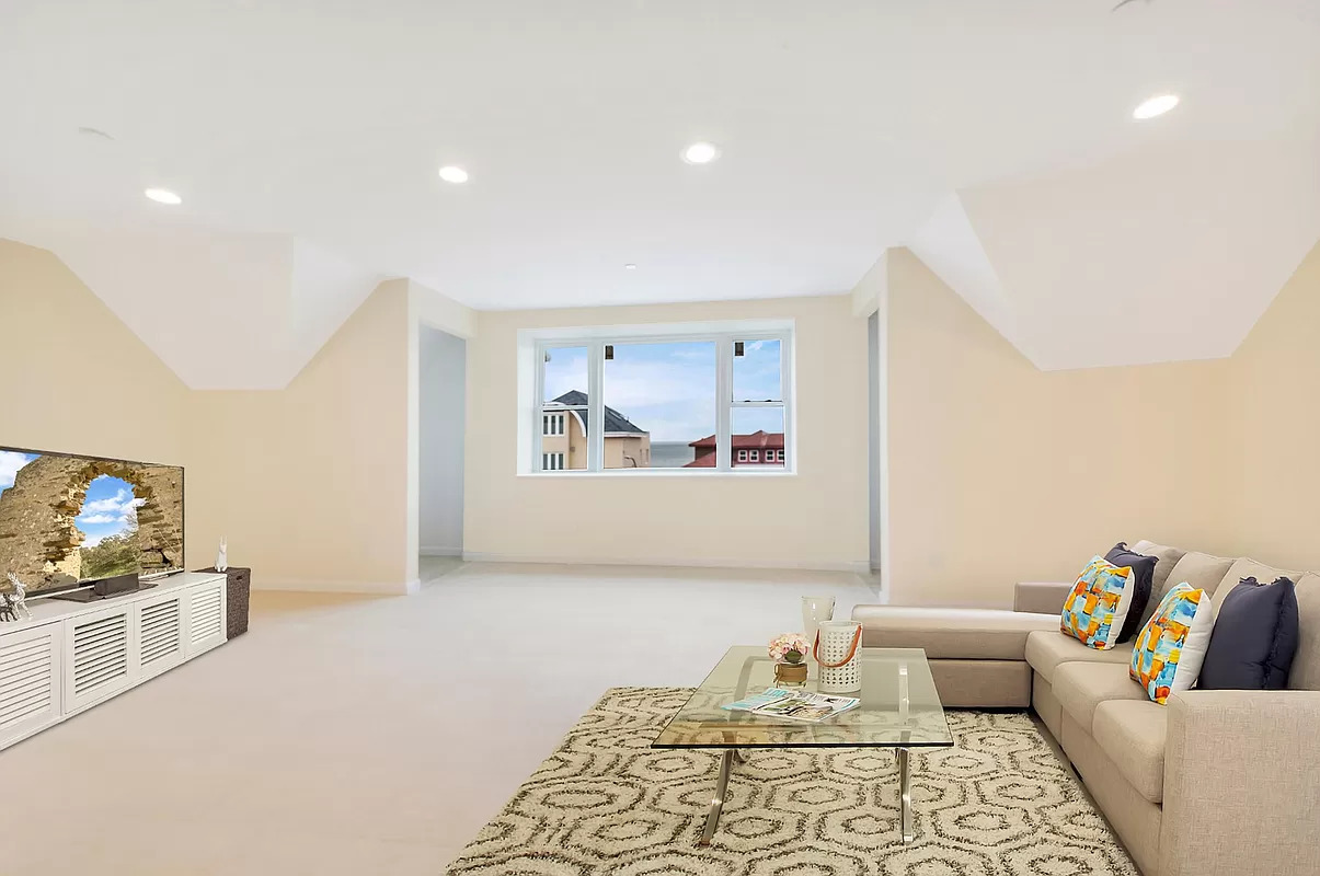 4015 Atlantic Avenue Brooklyn, NY 11224 - Photo 5 of 14 a living room with furniture and a flat screen tv