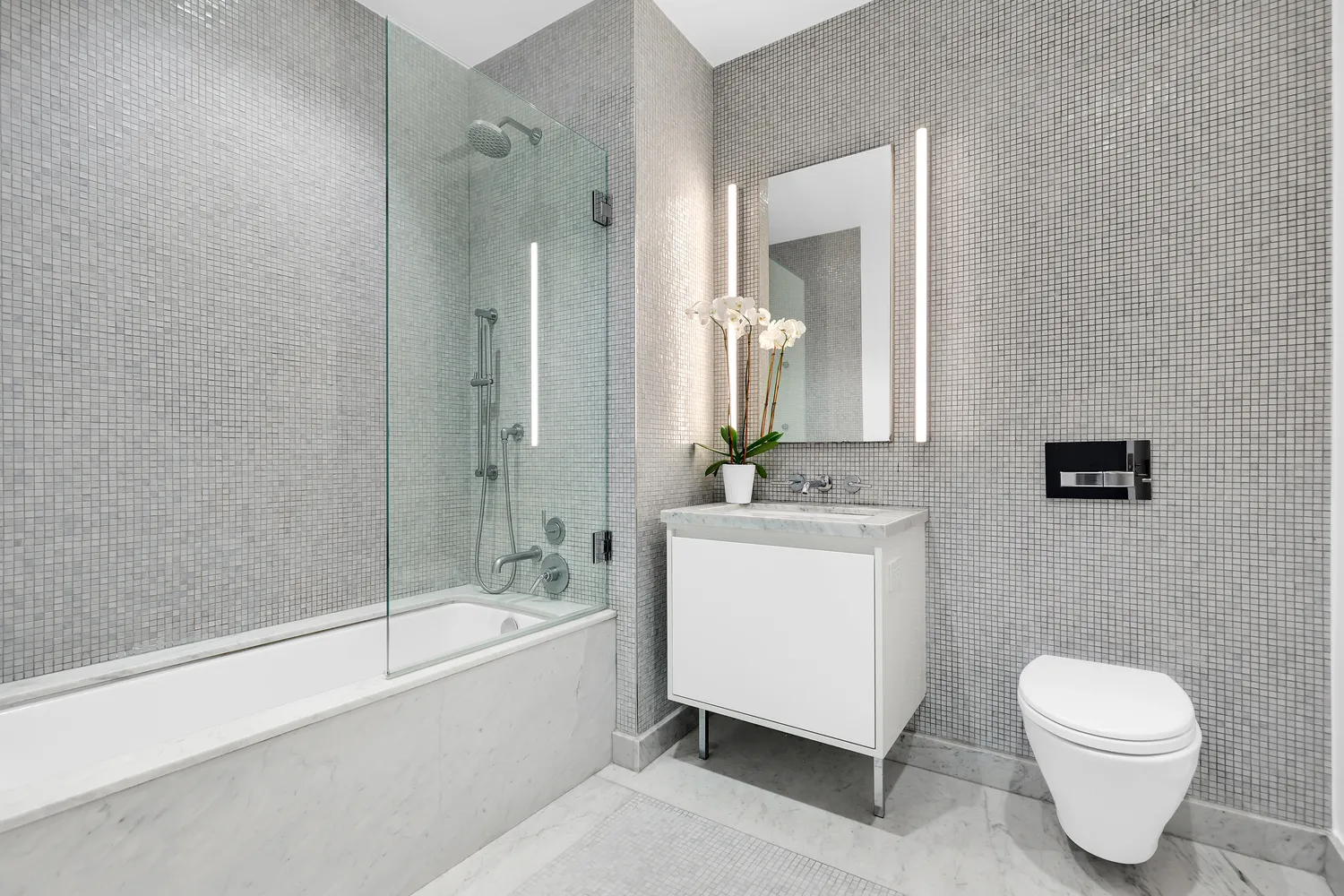 a bathroom with a toilet a sink and a bathtub