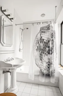 a bathroom with a sink bath tub and shower