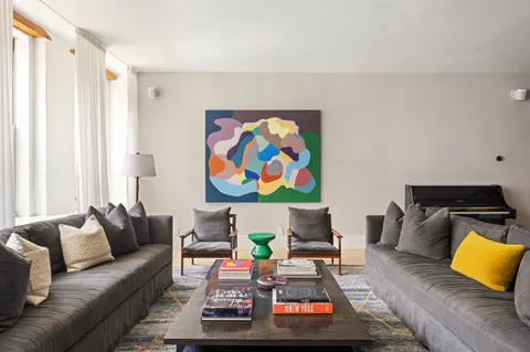 a living room with furniture and a couch