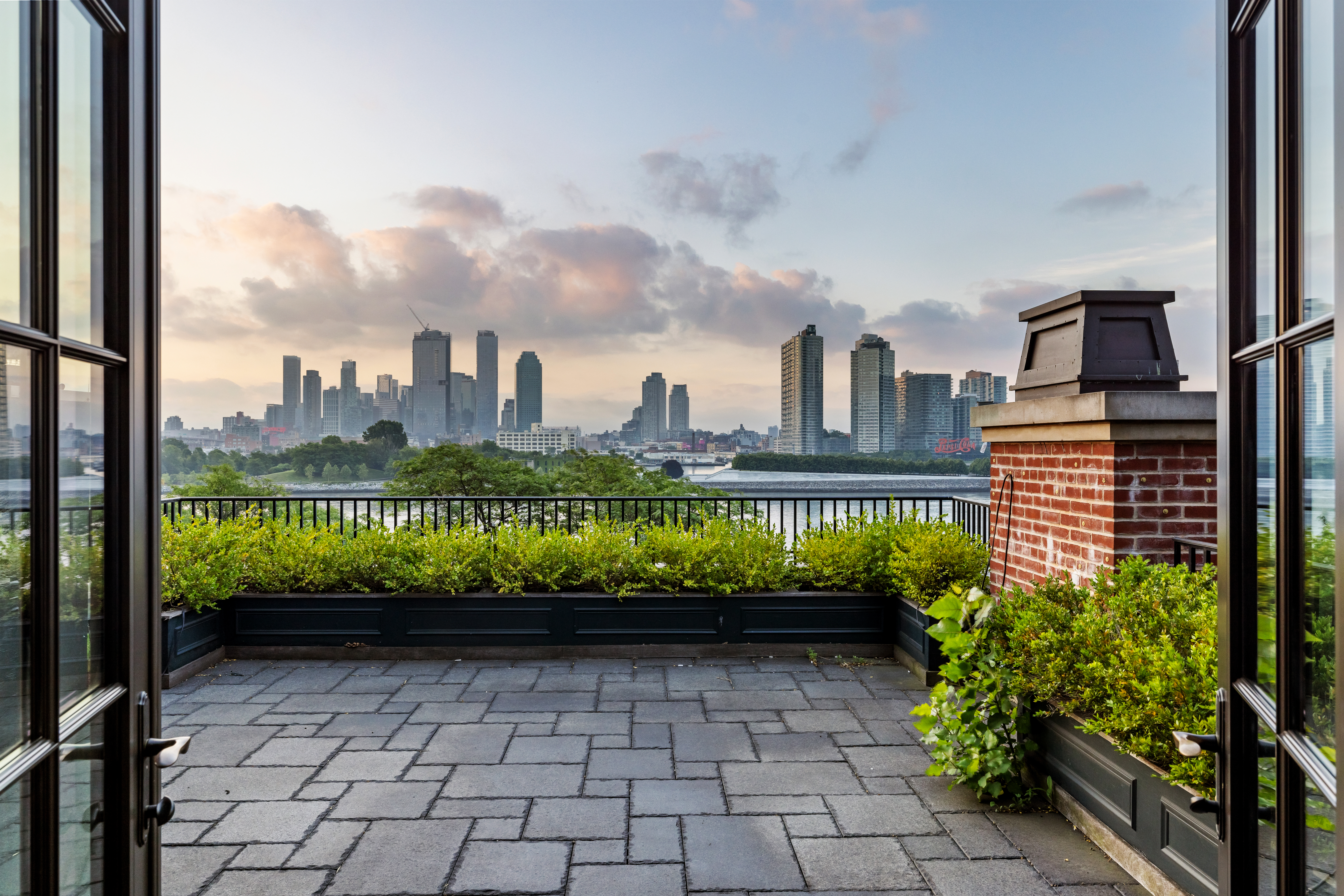 a view of a balcony with plants
