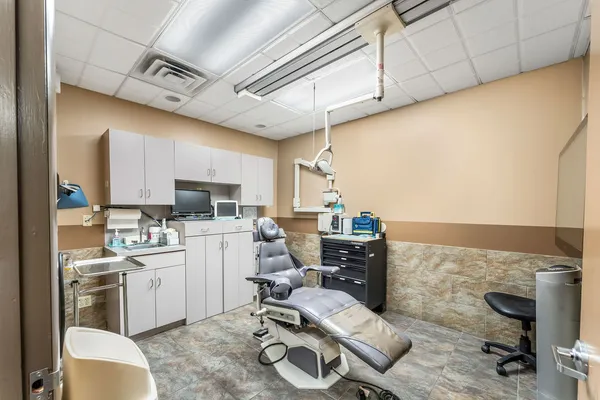 a view of a room with workspace and a window
