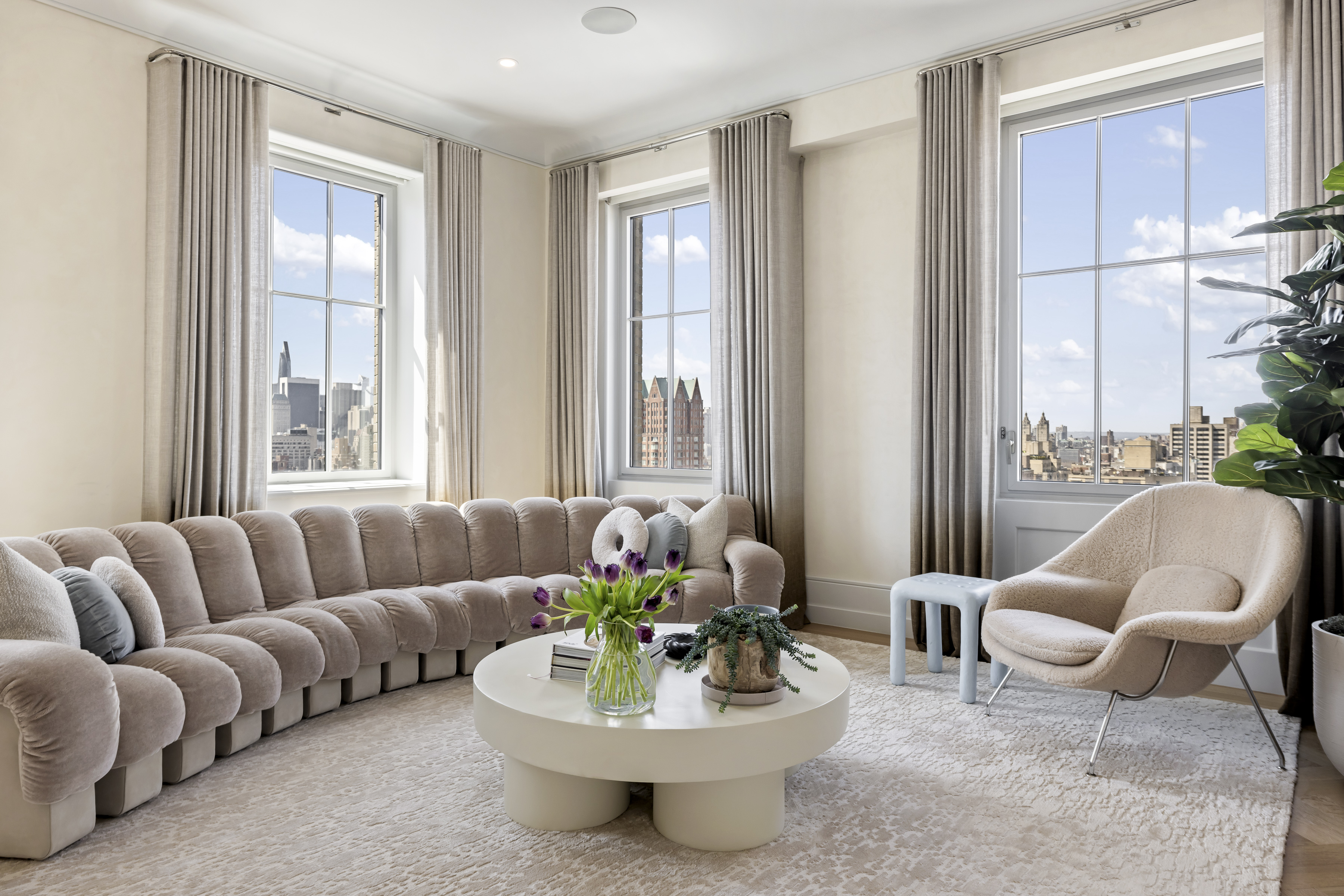 301 East 80th Street, Unit 25B Manhattan, NY 10075 - Photo 2 of 38 a living room with furniture and a large window