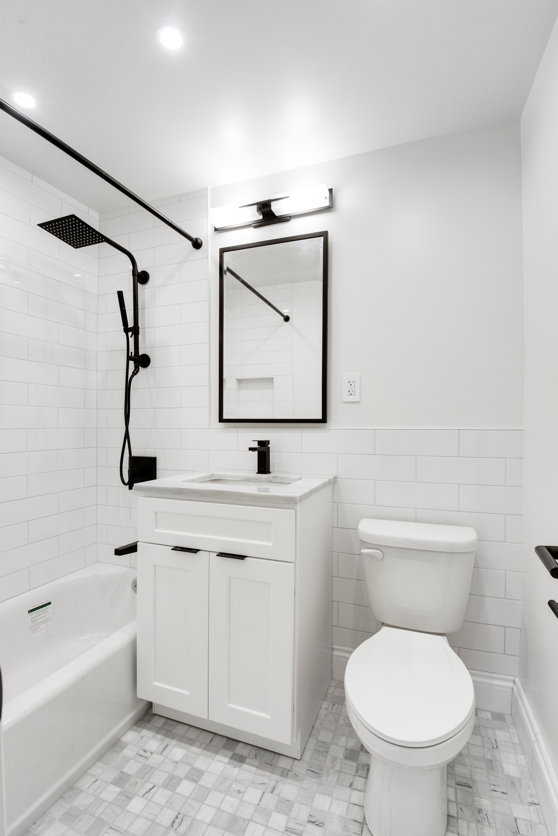 205 West End Avenue, Unit 15H Manhattan, NY 10023 - Photo 12 of 17 a bathroom with a toilet sink and mirror