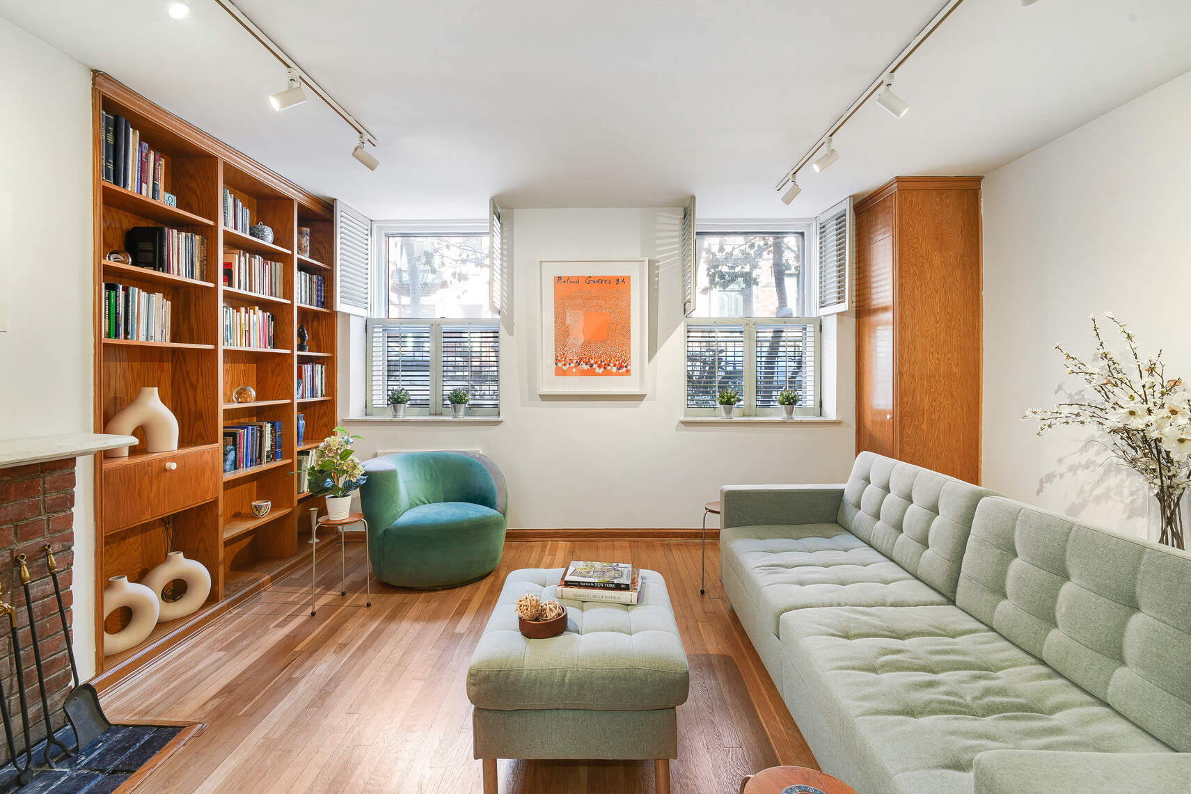 92 Remsen Street, Unit 1A Brooklyn, NY 11201 - Photo 2 of 12 a living room with furniture cabinets and a window