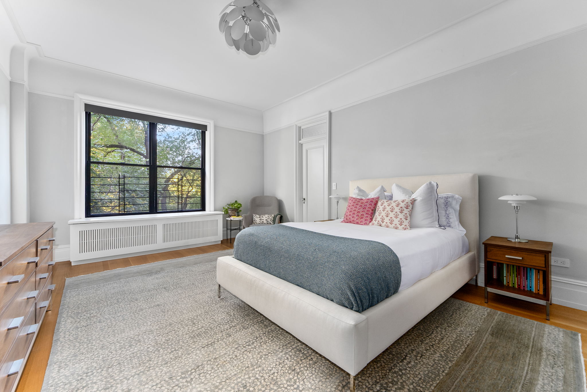 210 Riverside Drive, Unit 2E Manhattan, NY 10025 - Photo 7 of 15 a spacious bedroom with a bed and a large window