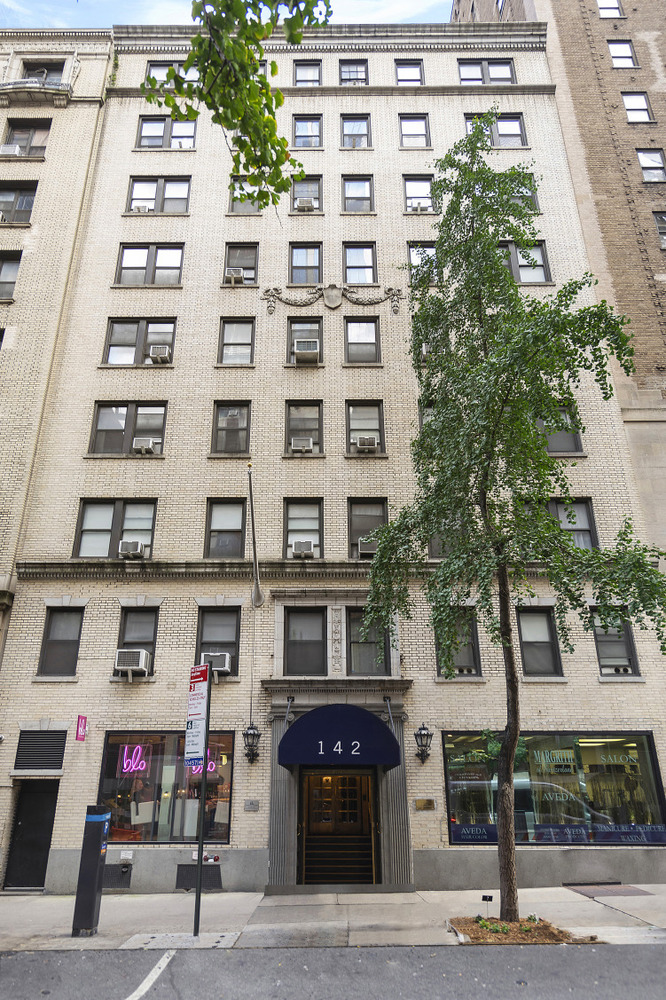 142 East 49th Street, Unit 7B Manhattan, NY 10017 - Photo 6 of 11 a front view of a building with street view