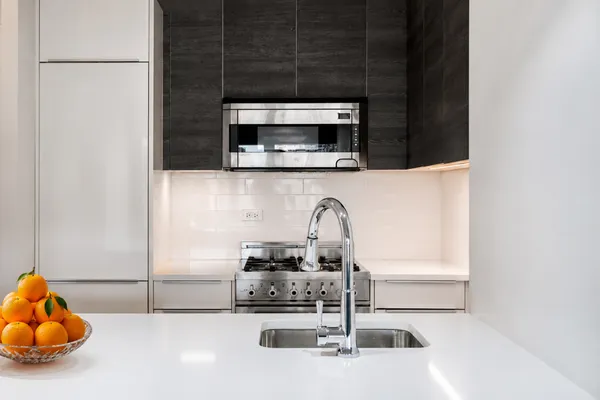 a kitchen with a sink and a microwave
