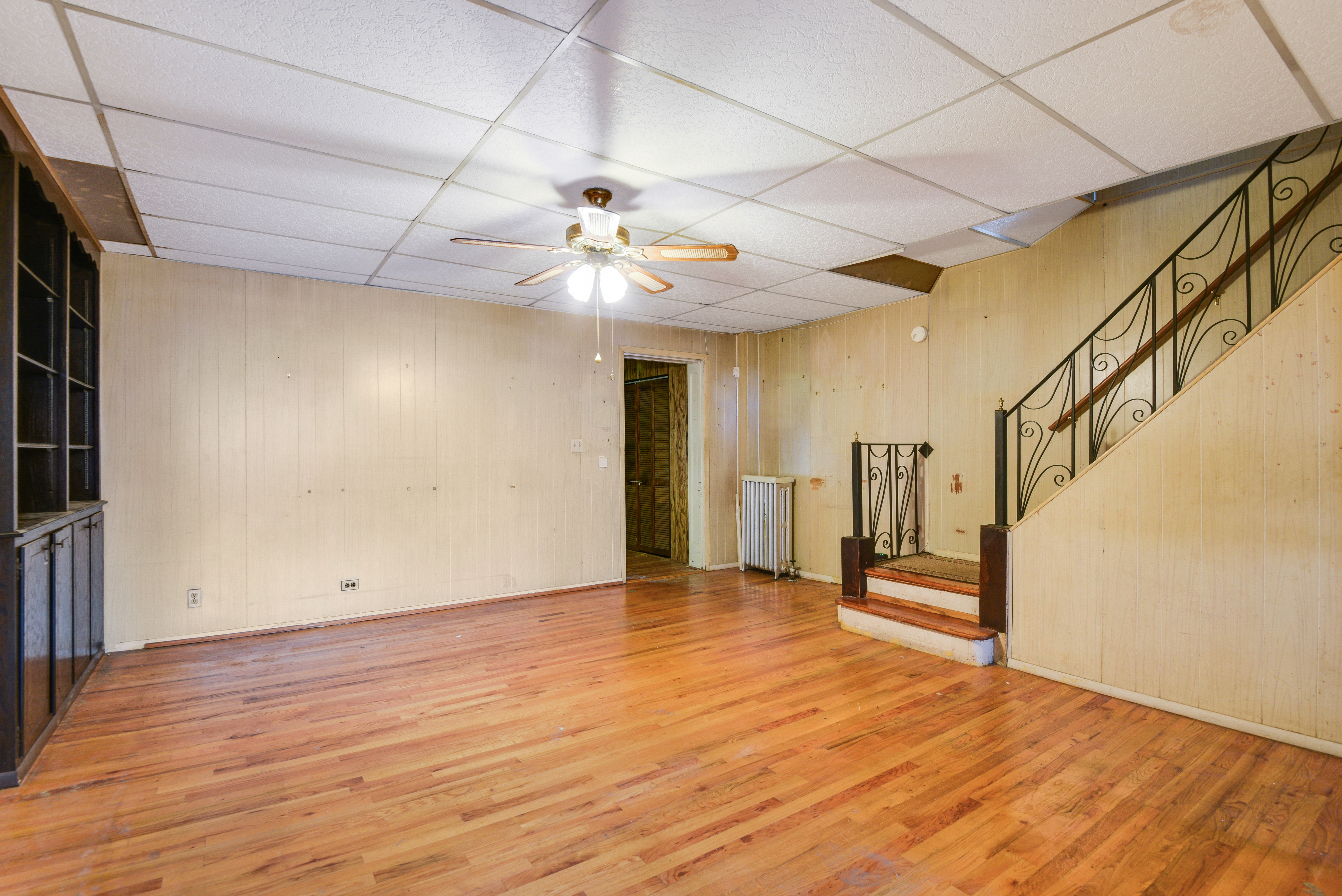 75-36 60th Lane Queens, NY 11385 - Photo 5 of 18 a view of empty room with wooden floor