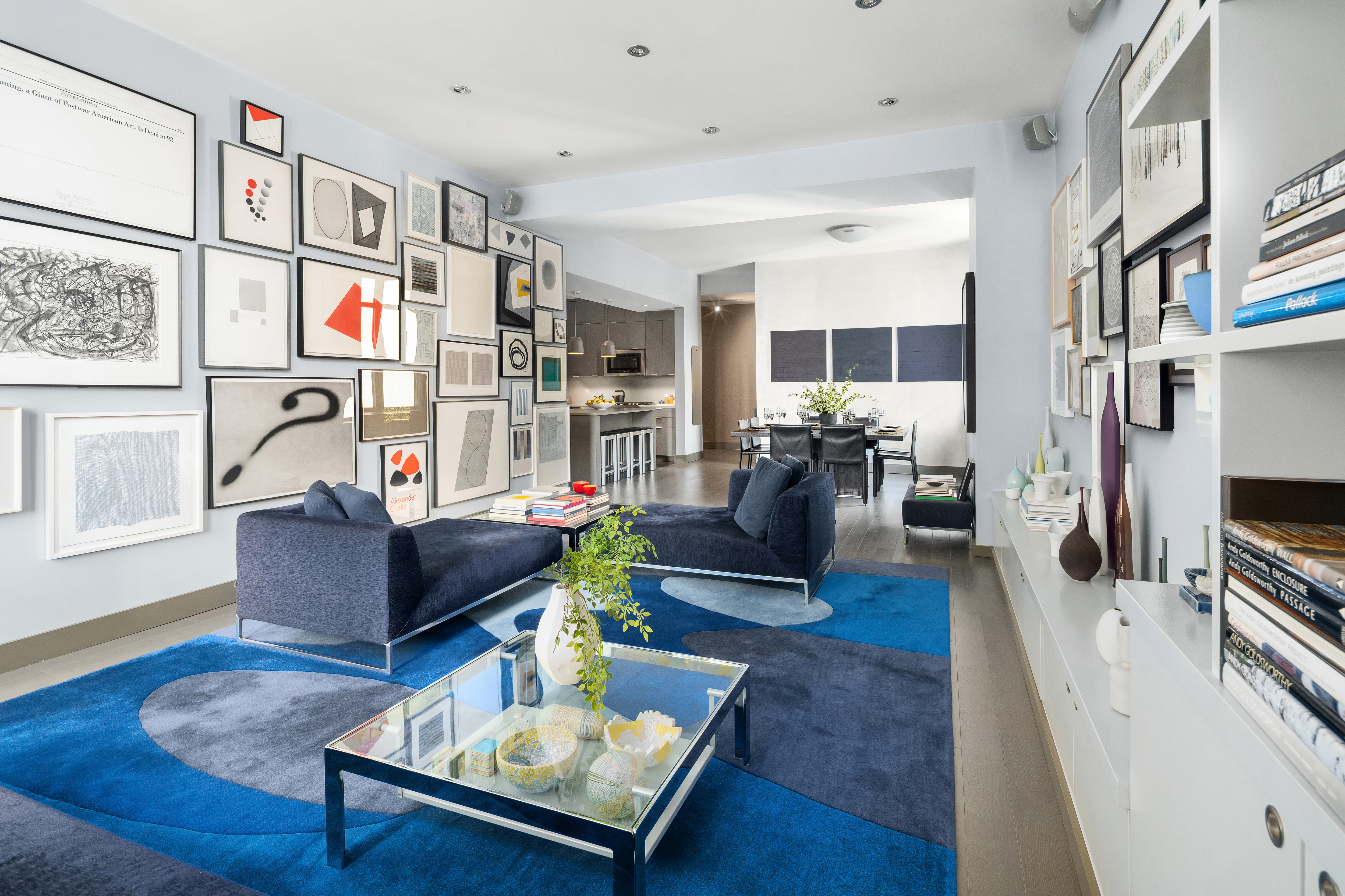 252 7th Avenue, Unit 9D Manhattan, NY 10001 - Photo 4 of 23 a living room with furniture and a flat screen tv
