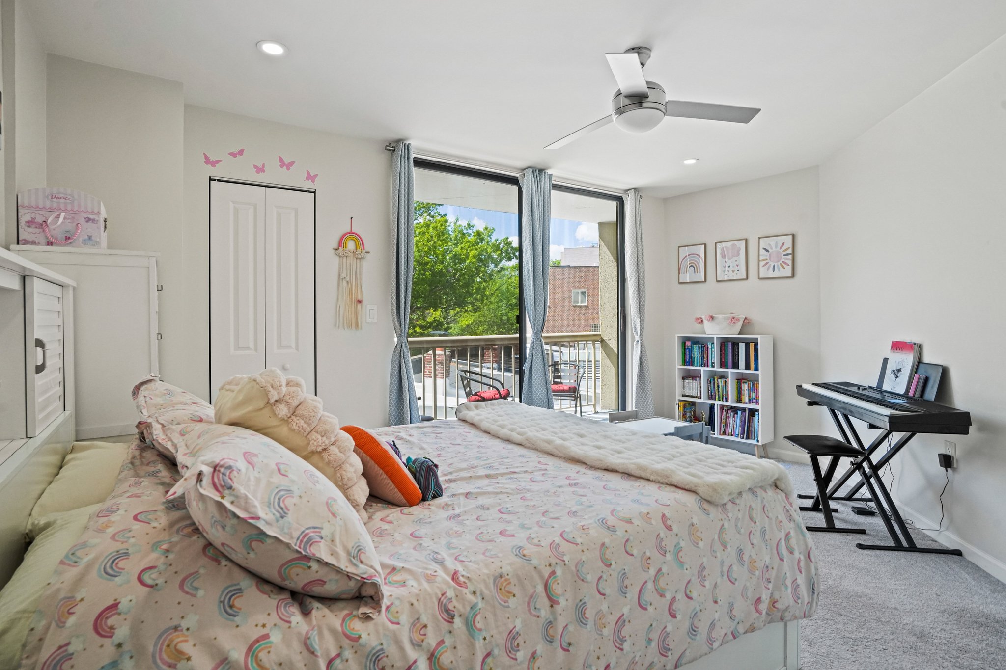 2725 Connecticut Avenue Northwest, Unit 507 Washington, DC 20008 - Photo 22 of 31 a bedroom with a bed and a chandelier