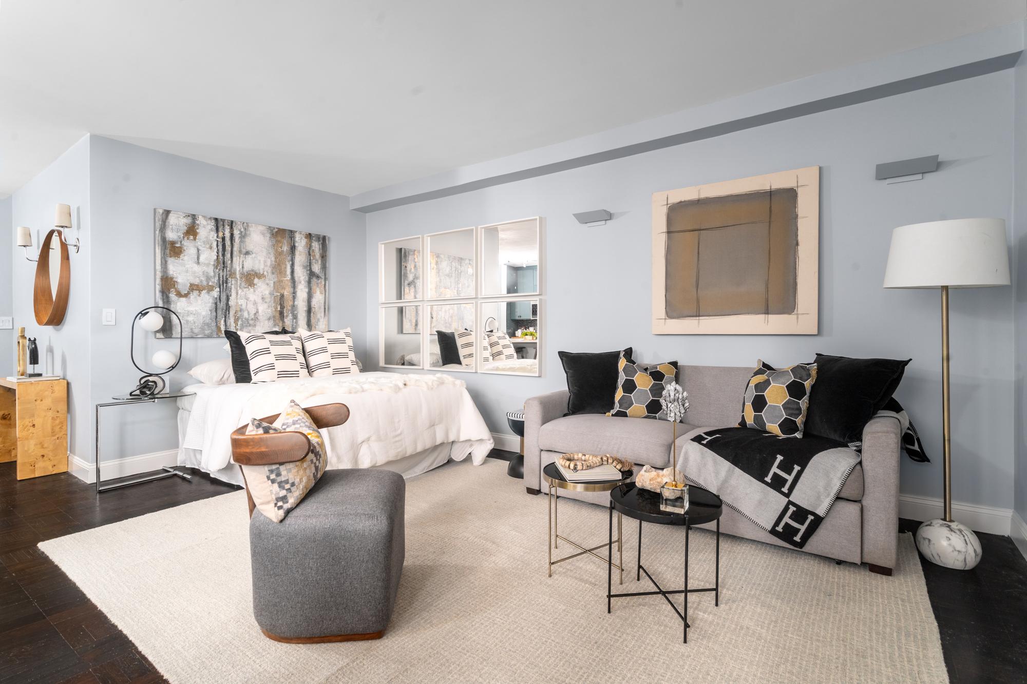 315 East 72nd Street, Unit 16A Manhattan, NY 10021 - Photo 4 of 12 a living room with furniture and a large window