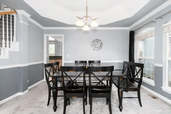 a living room with furniture large window and a fireplace