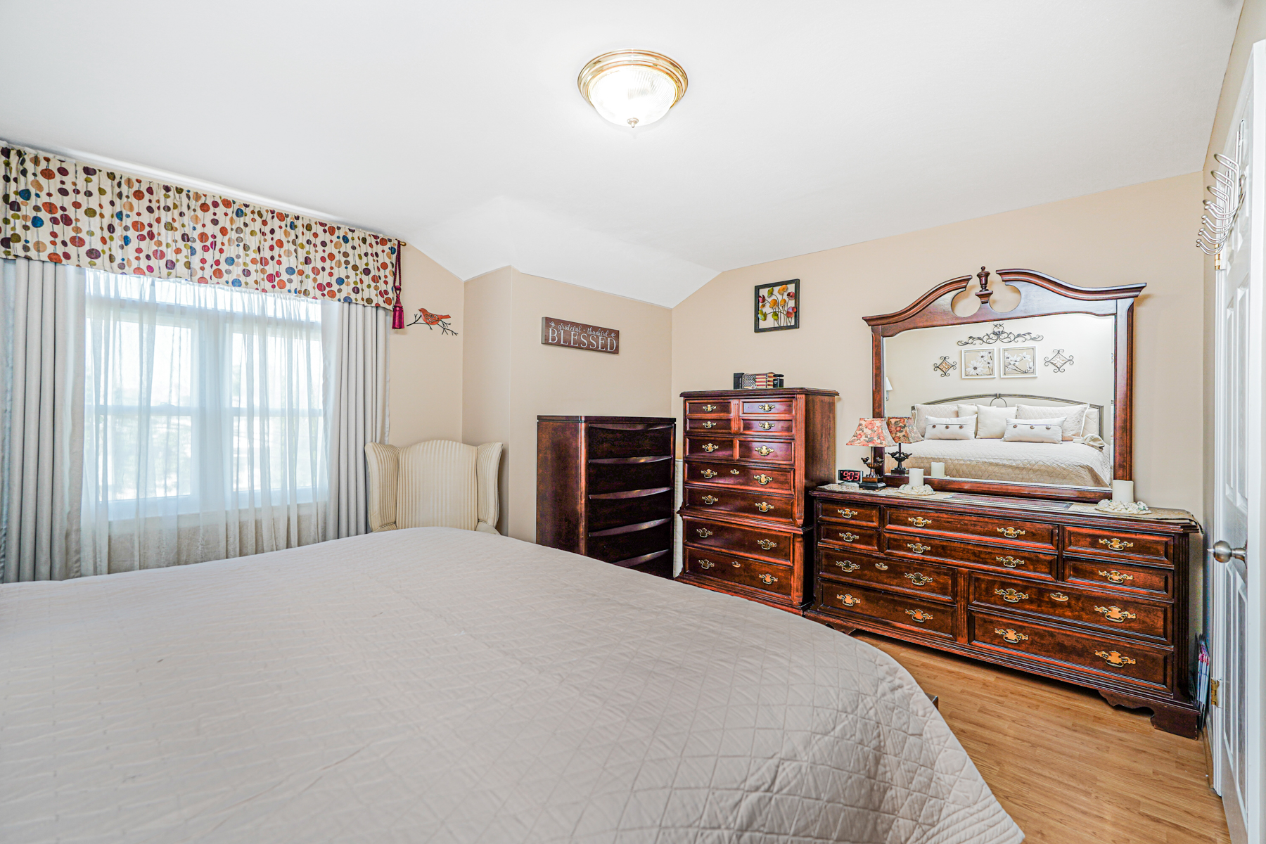287 Greaves Avenue Staten Island, NY 10308 - Photo 17 of 35 a bedroom with a bed and a dresser
