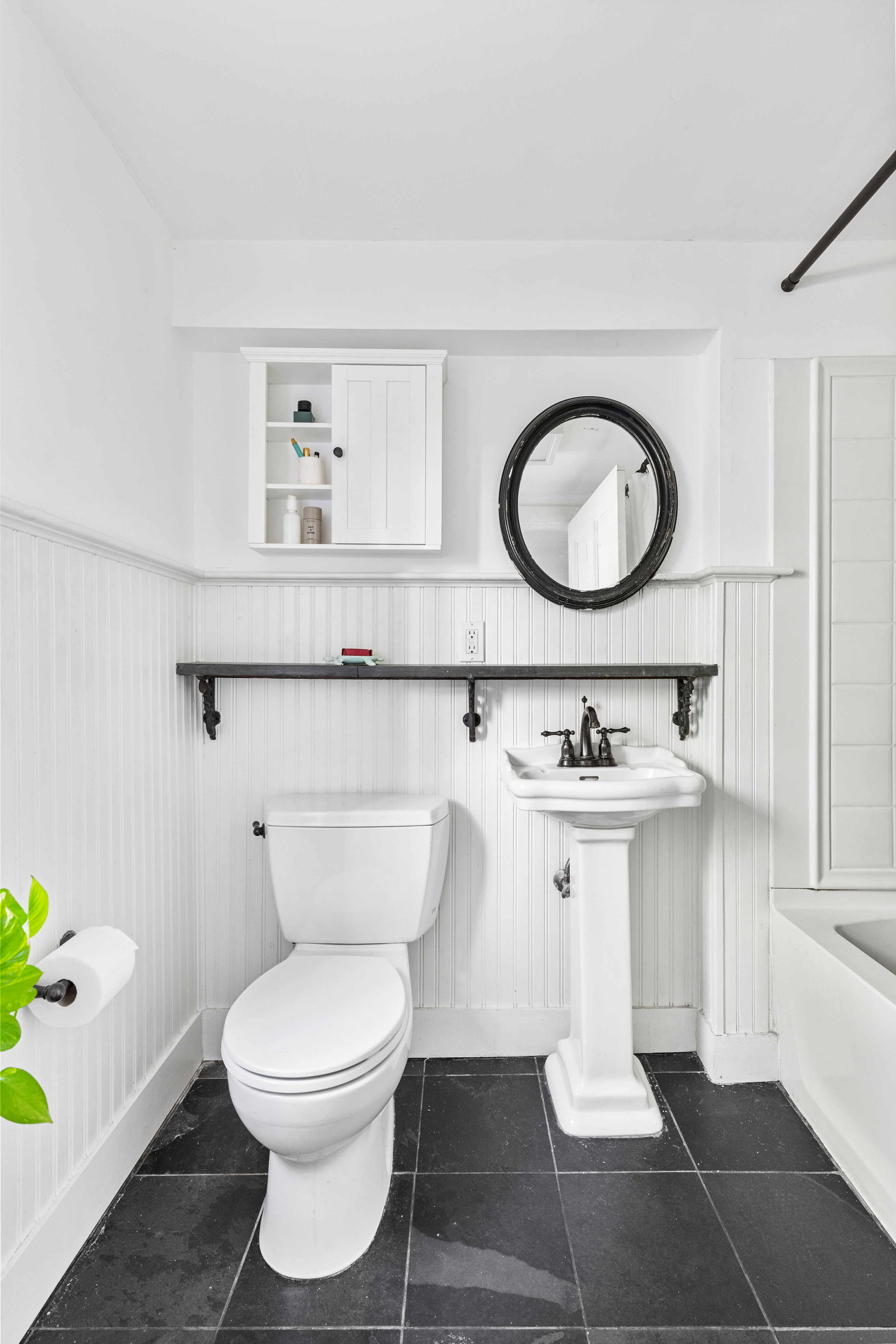 955 Bushwick Avenue Brooklyn, NY 11221 - Photo 13 of 19 a bathroom with a toilet sink and mirror