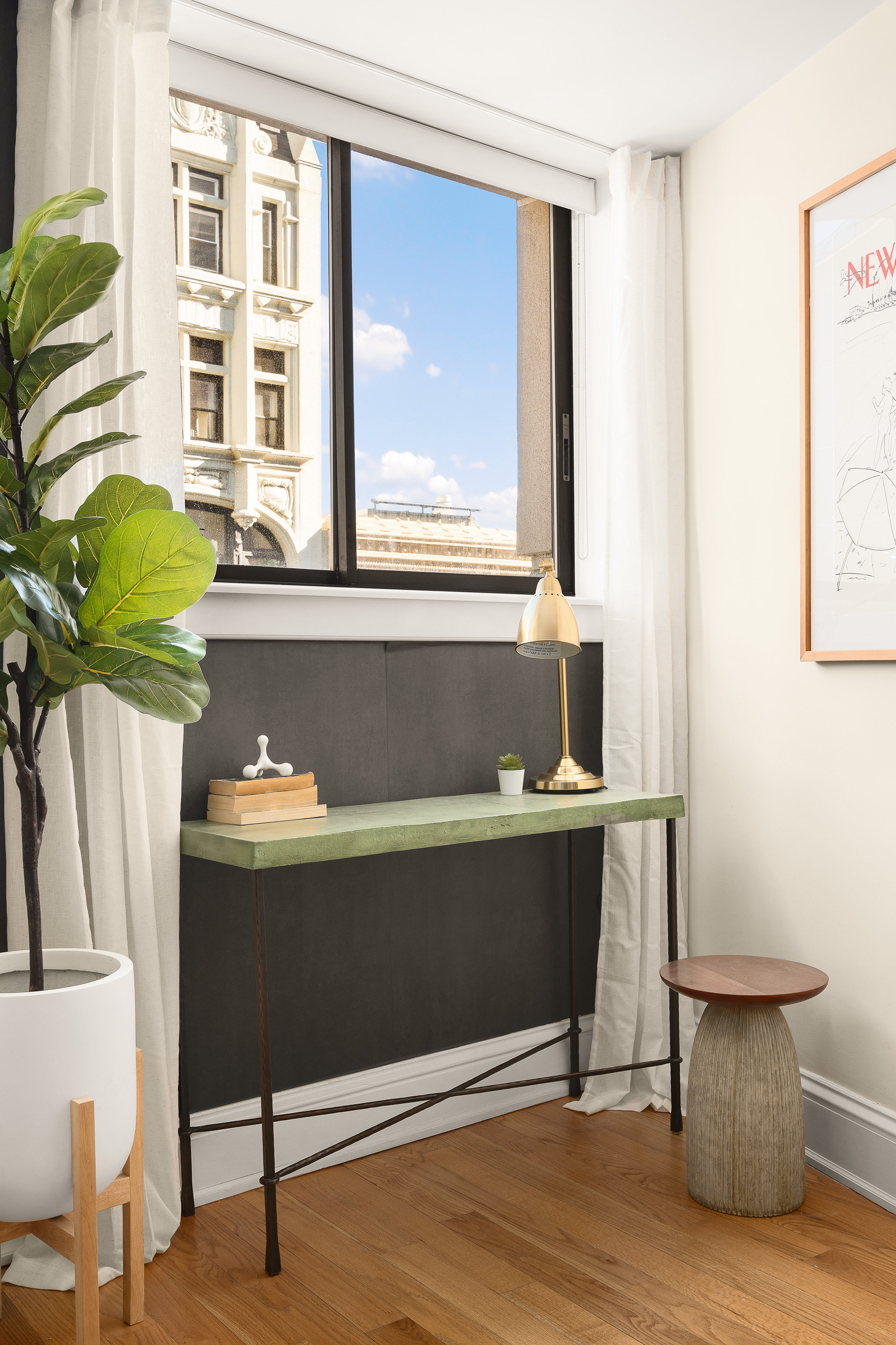 67 East 11th Street, Unit 624 Manhattan, NY 10003 - Photo 3 of 13 a living room with a table chair and a potted plant