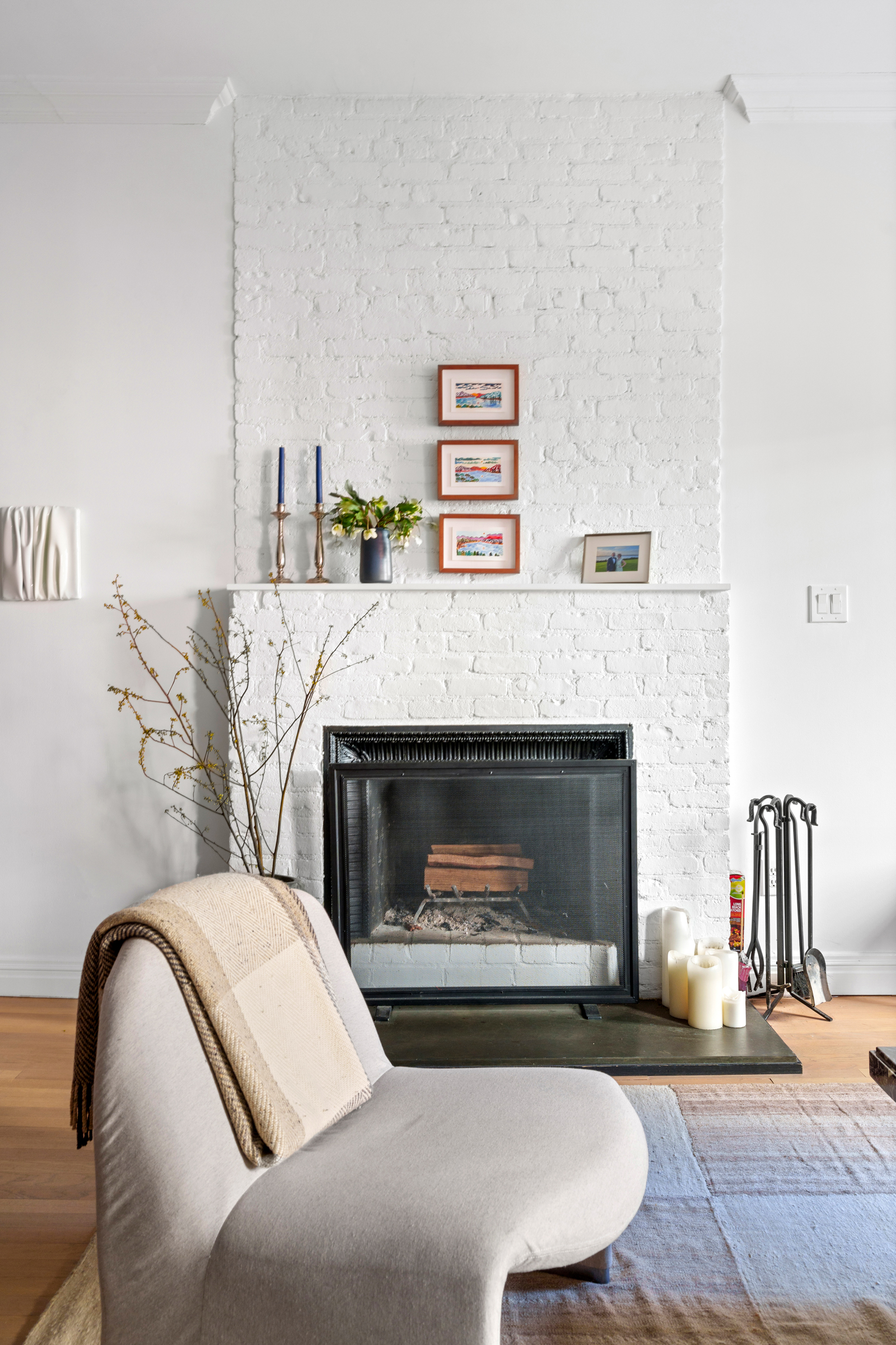 158 East 22nd Street, Unit 4 Manhattan, NY 10010 - Photo 3 of 15 a bedroom with a bed and a fireplace