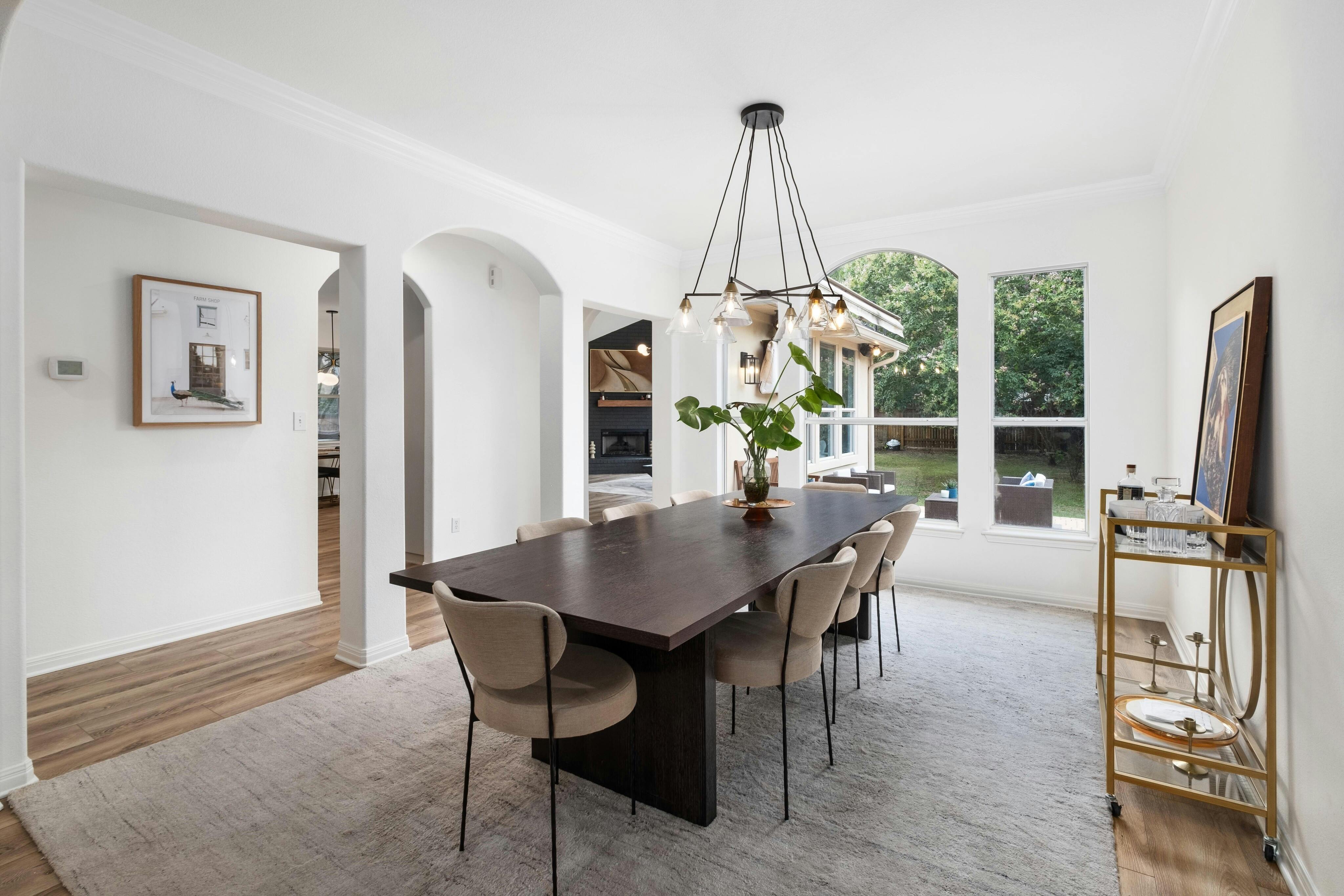 10608 Pointe View Drive Austin, TX 78738 - Photo 9 of 46 a view of a dining room with furniture window and wooden floor