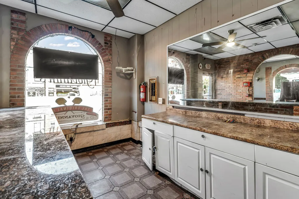 a bathroom with a double vanity sink and mirror