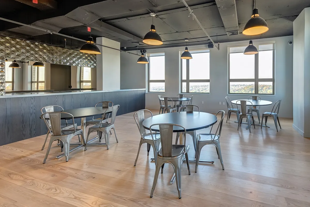 626 Flatbush Avenue, Unit 7E Brooklyn, NY 11225 - Photo 13 of 23 a dining room with furniture a chandelier and wooden floor
