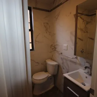 a bathroom with a sink and toilet