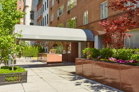 a front view of a building with flowers