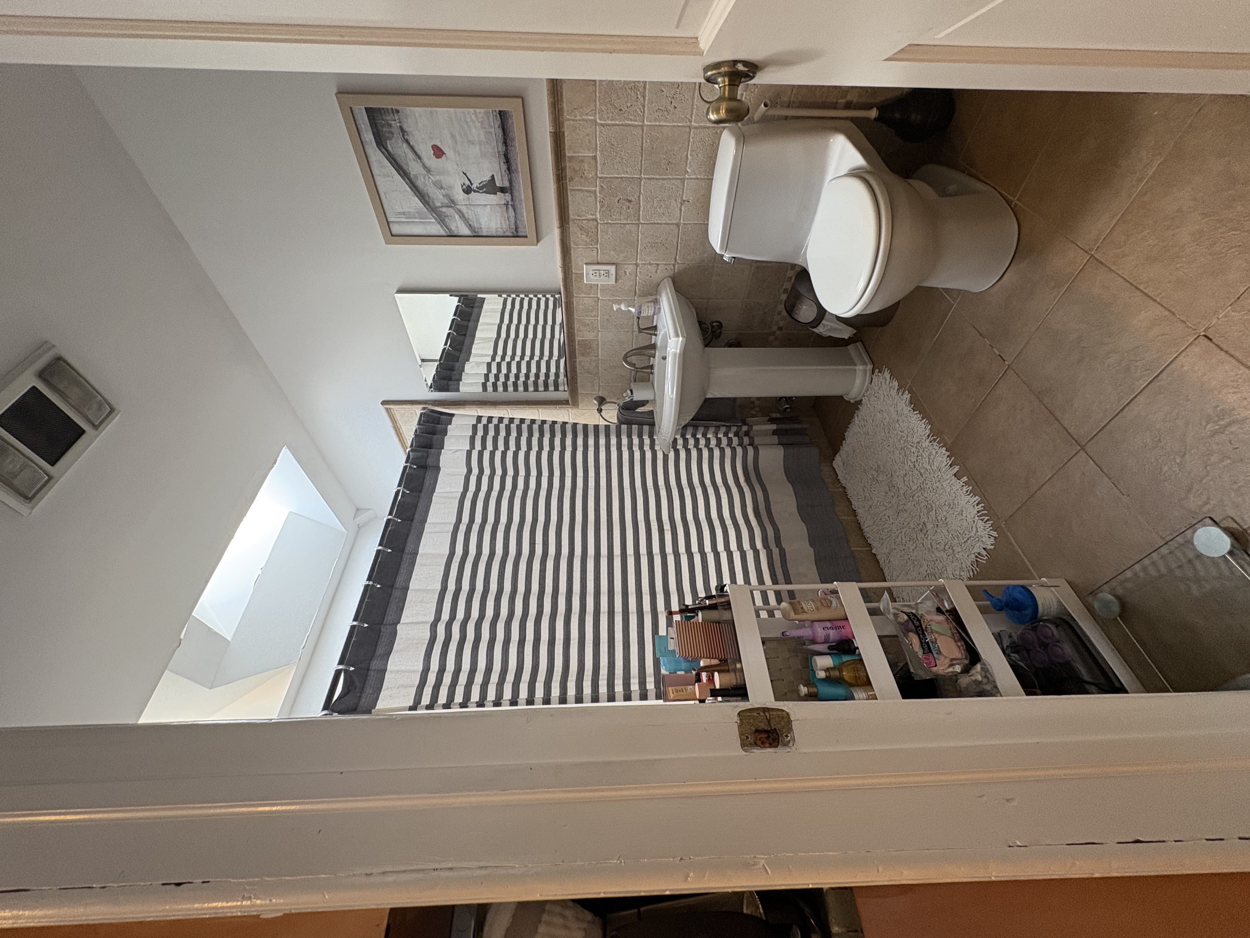 304 7th Avenue, Unit 3 Brooklyn, NY 11215 - Photo 8 of 15 a bathroom with a toilet a sink and mirror