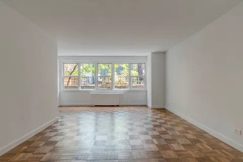 a view of an empty room and window