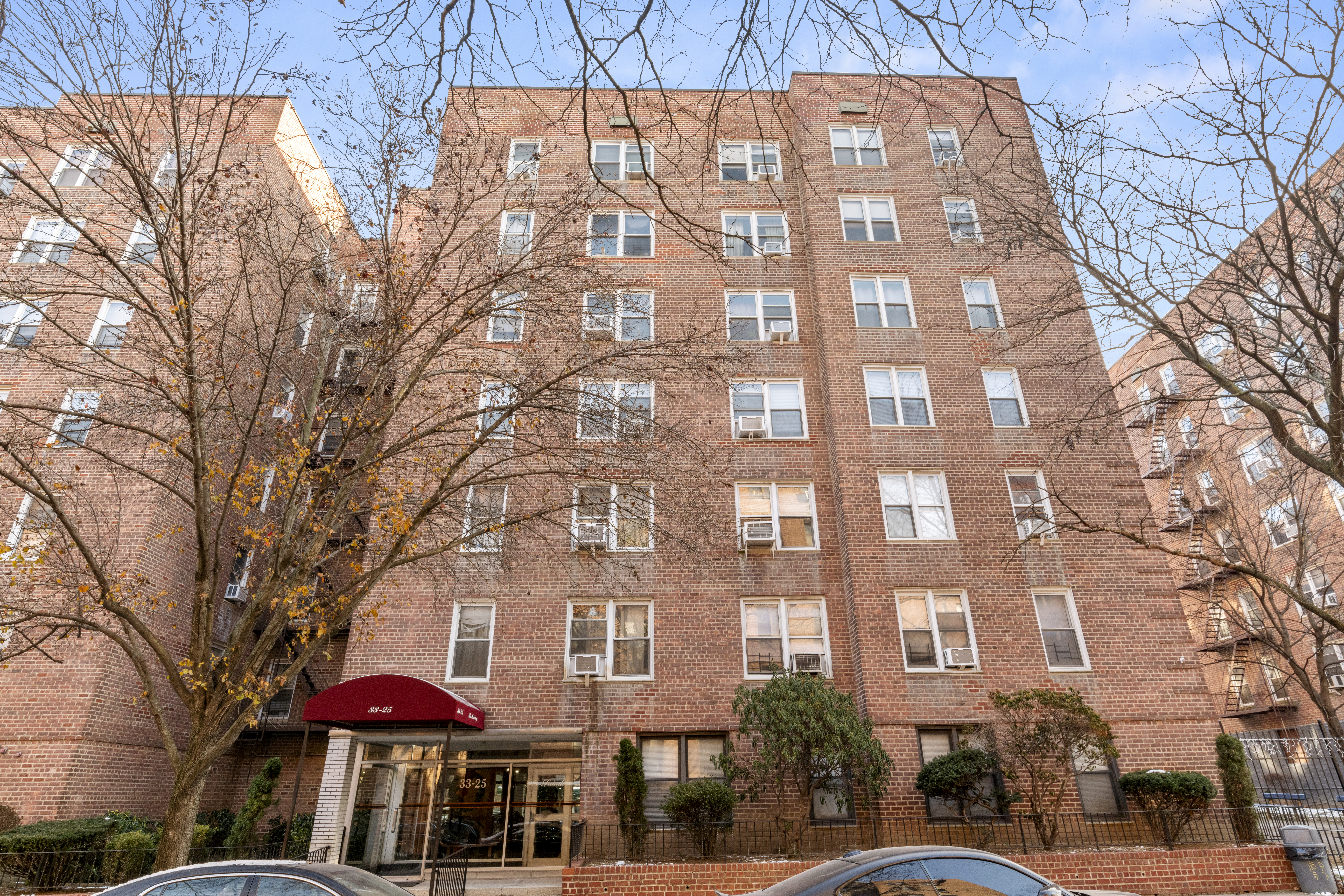 33-25 92nd Street, Unit 2A Queens, NY 11372 - Photo 1 of 1 a view of a building with a yard
