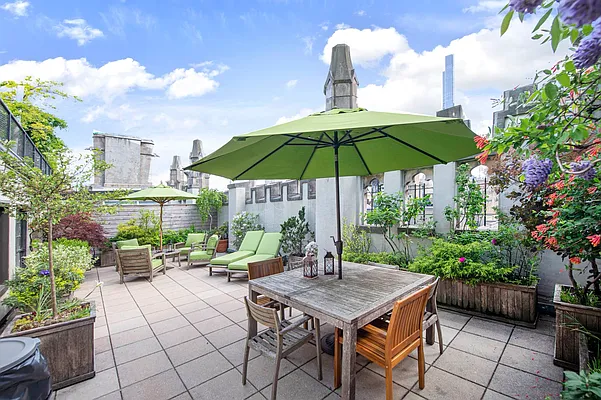 1 West 67th Street, Unit 2M Manhattan, NY 10023 - Photo 12 of 16 a view of backyard with seating space and plants