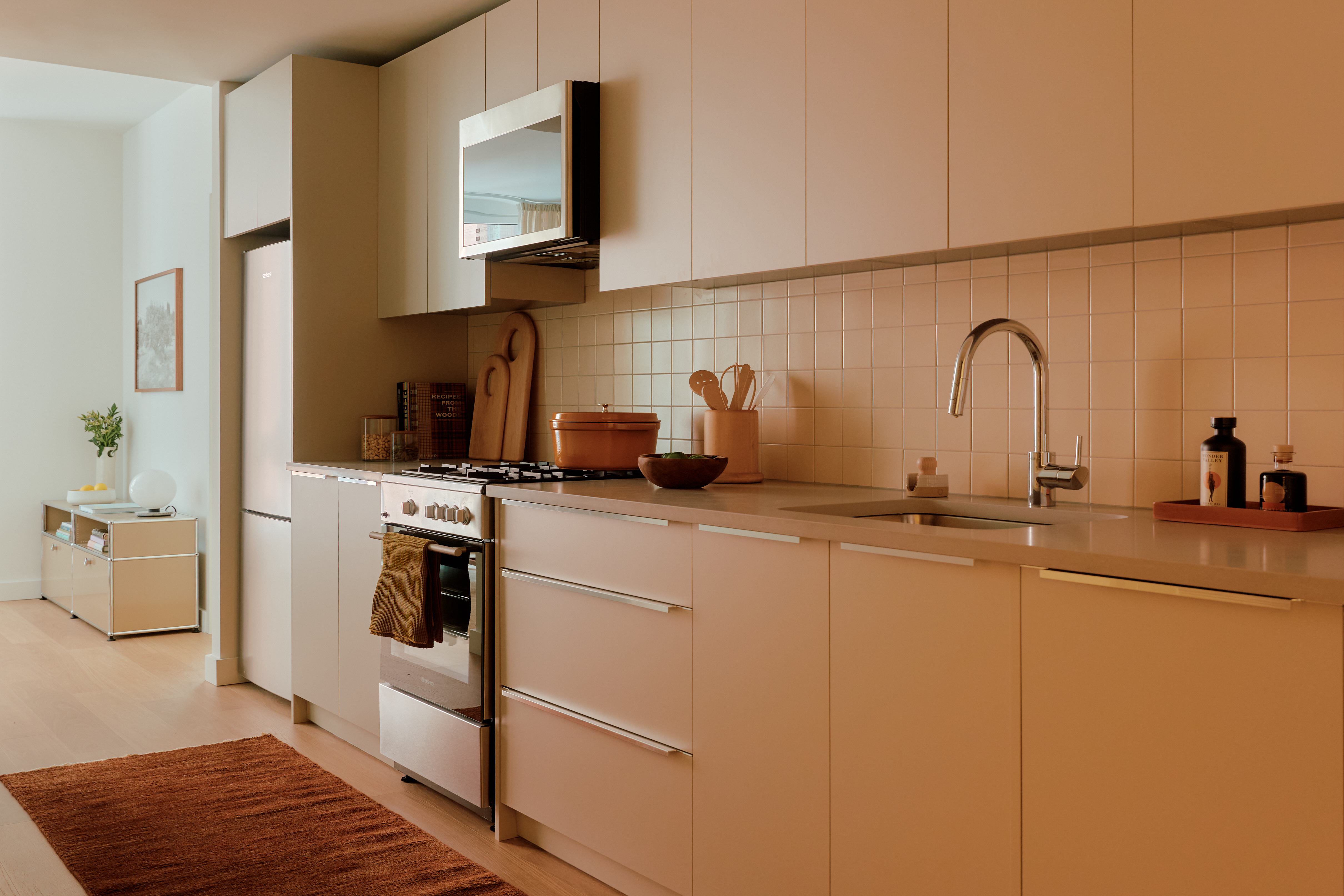 2035 5th Avenue, Unit 19R Manhattan, NY 10035 - Photo 2 of 14 a kitchen with a sink cabinets and appliances